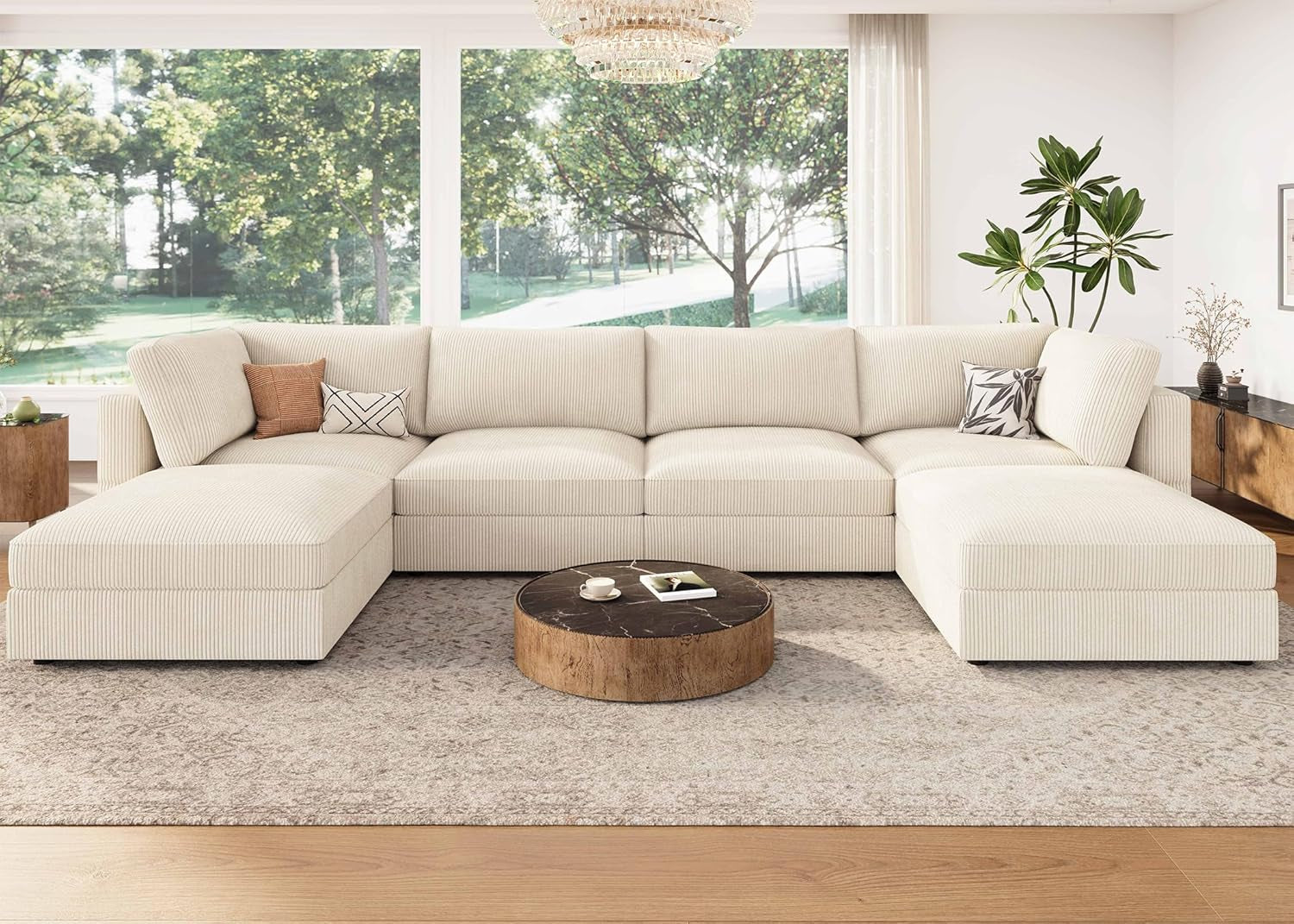 Beige sectional sofa in a living room with a wooden coffee table and decorative items.