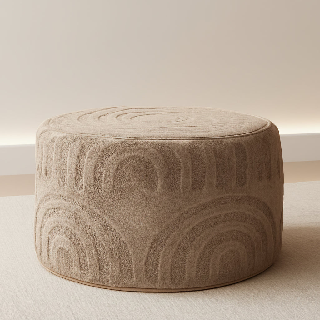 Beige textured ottoman on a white background