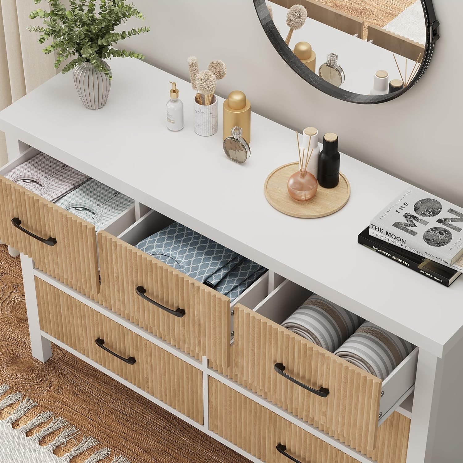 White dresser with wooden drawers in a room setting