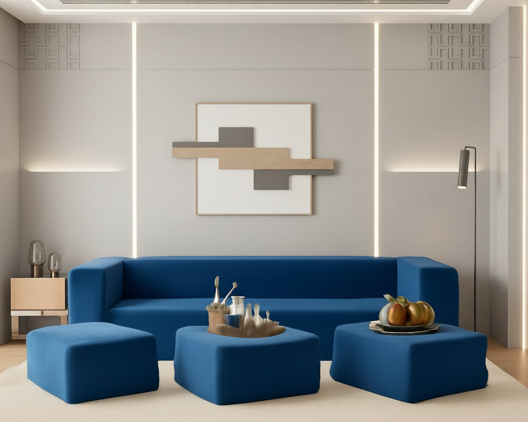 Blue sofa set with ottomans in a modern living room setting.