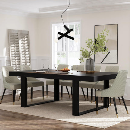 Dining room with a black table and gray chairs in a well-lit room.