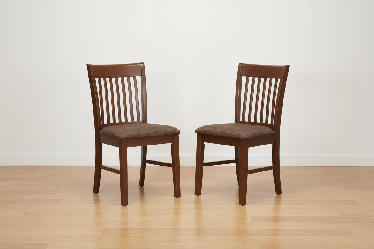 Two wooden chairs with brown seats on a white background