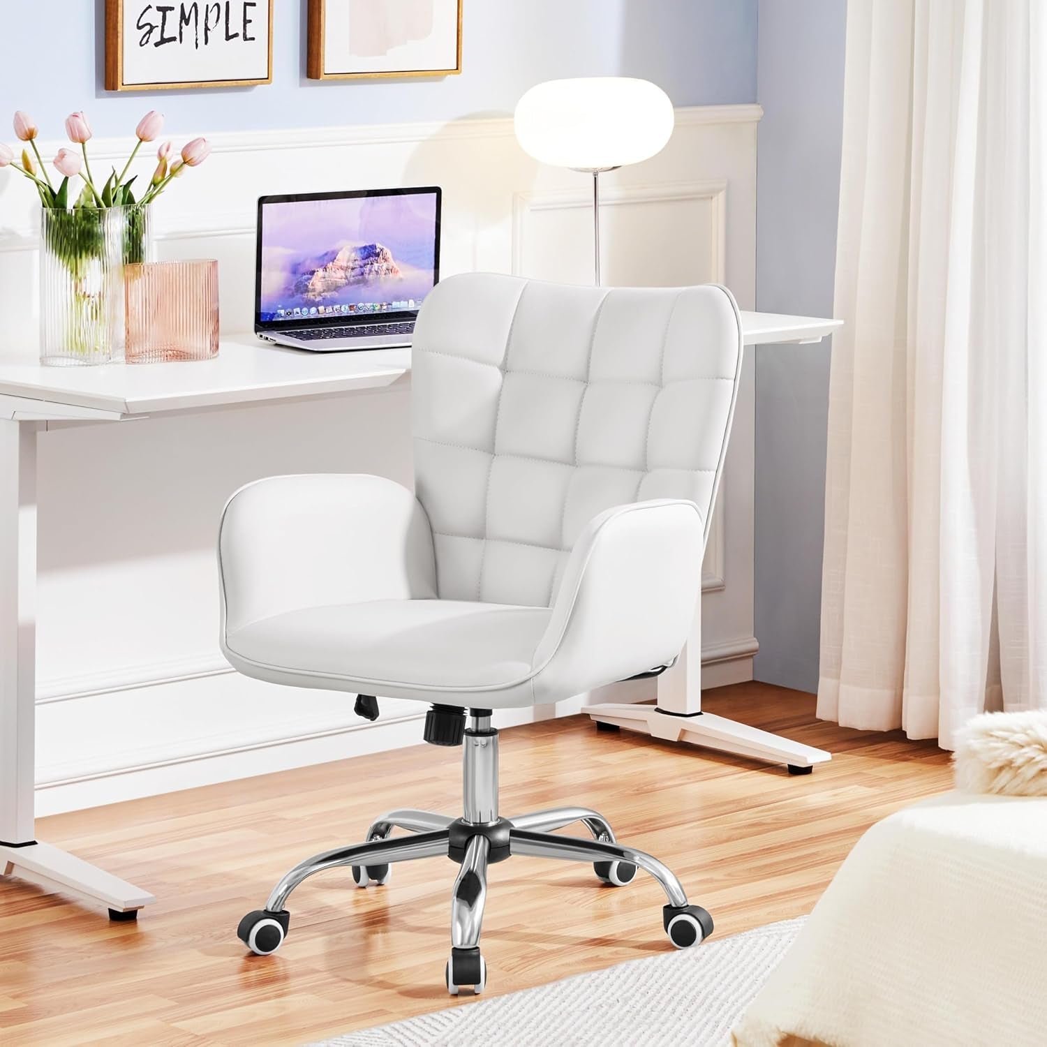 White office chair in a home office setting with a desk and decor.