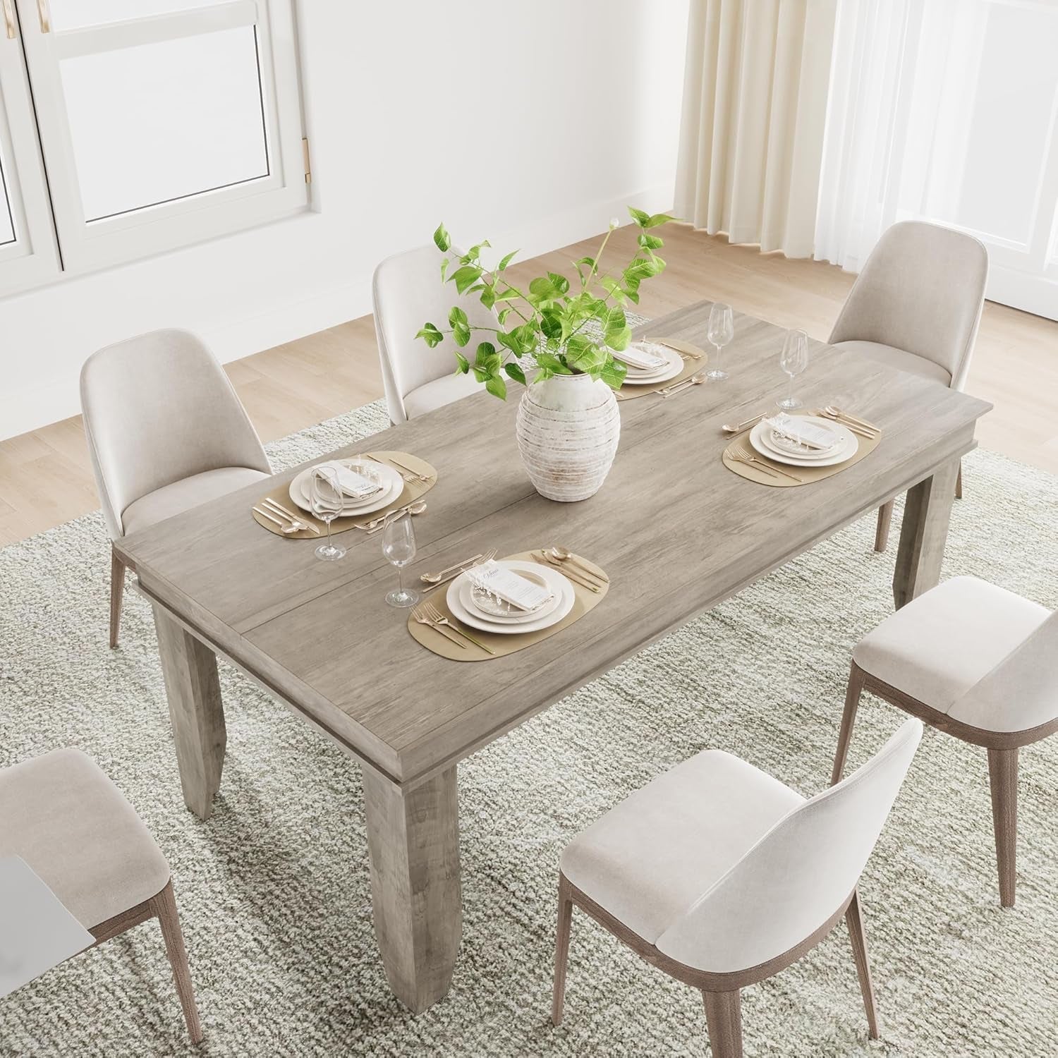 Dining table set with chairs and tableware in a bright room