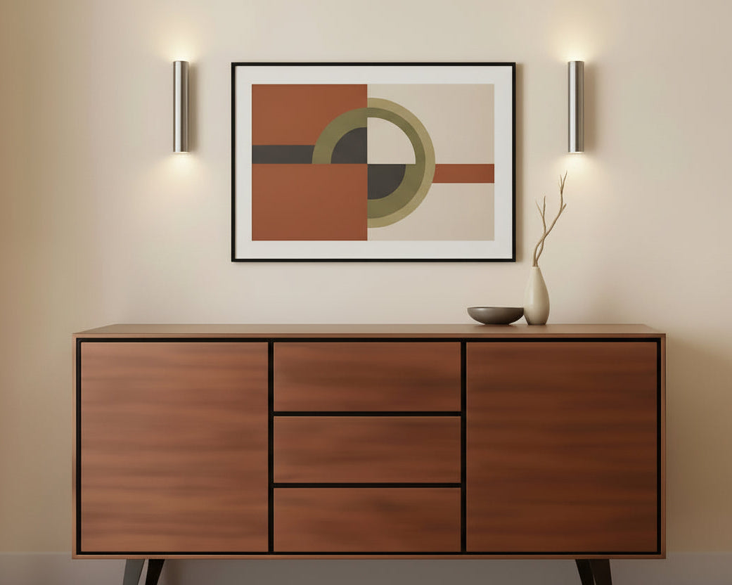 Wooden sideboard against an orange wall with decorative items on top
