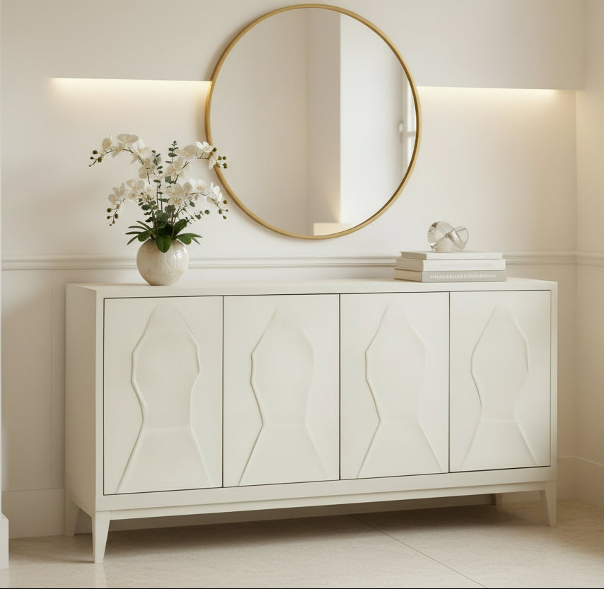 Beige sideboard with decorative items against a peach wall