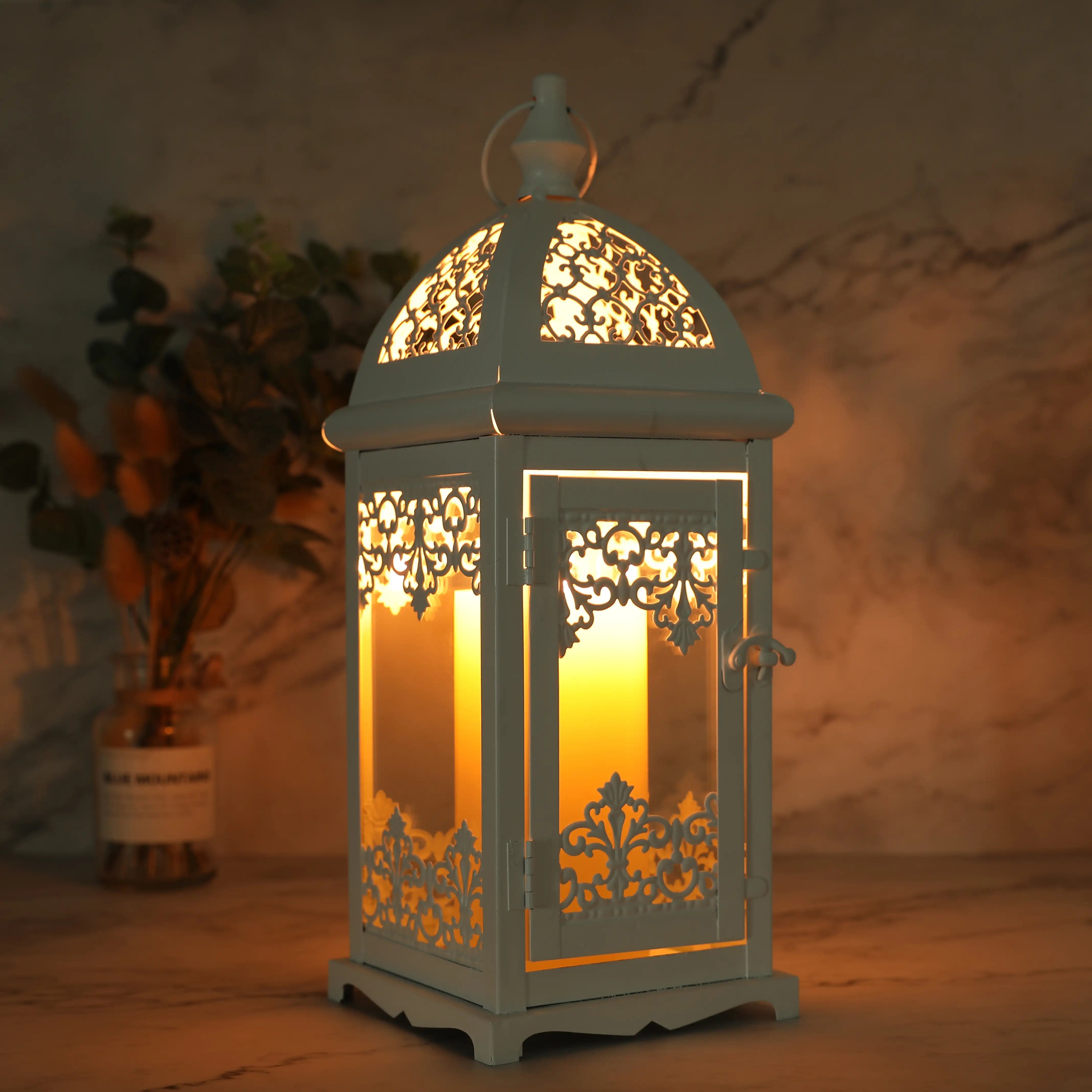 Decorative lantern with warm glow in a softly blurred background