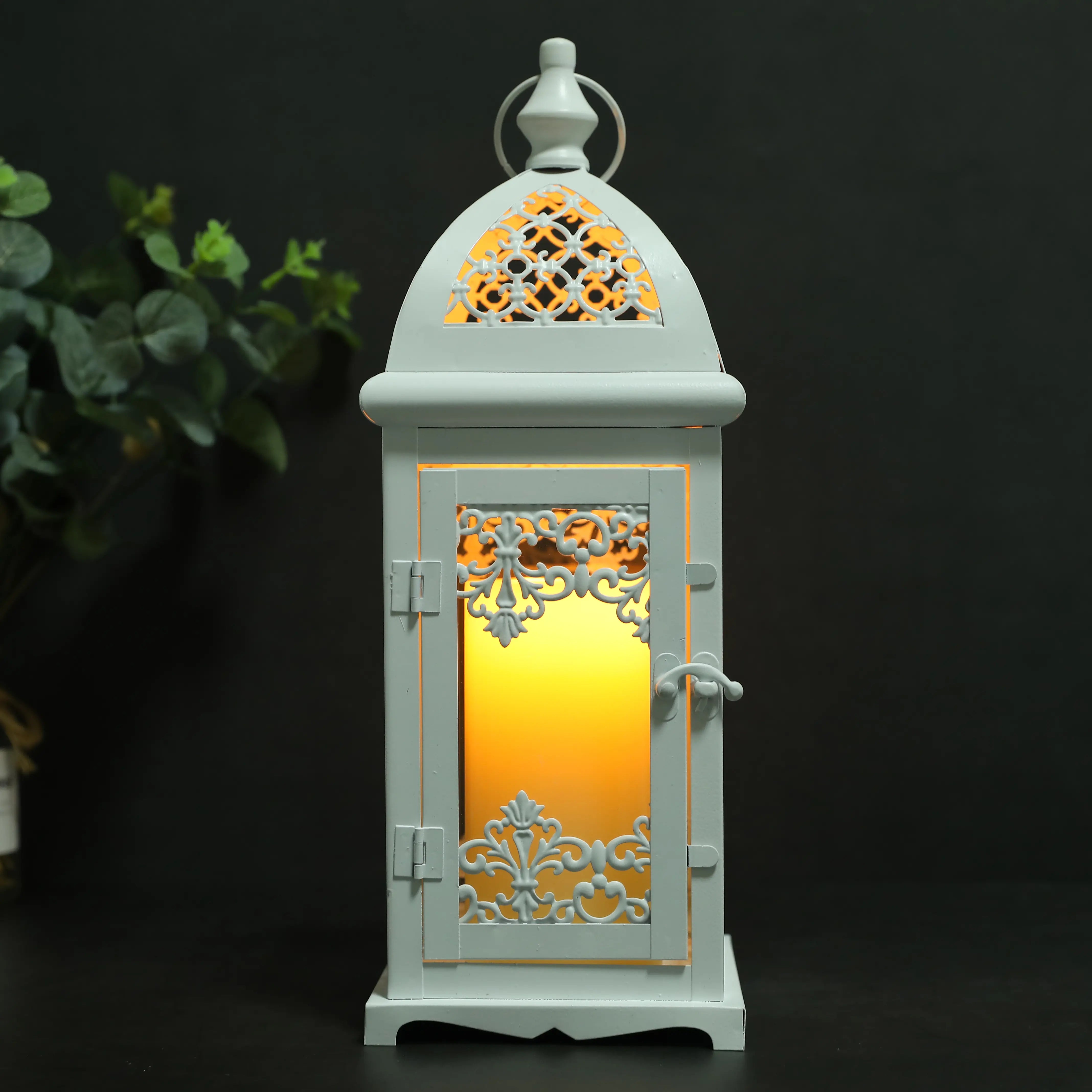 Decorative lantern with intricate patterns and a warm glow on a dark background