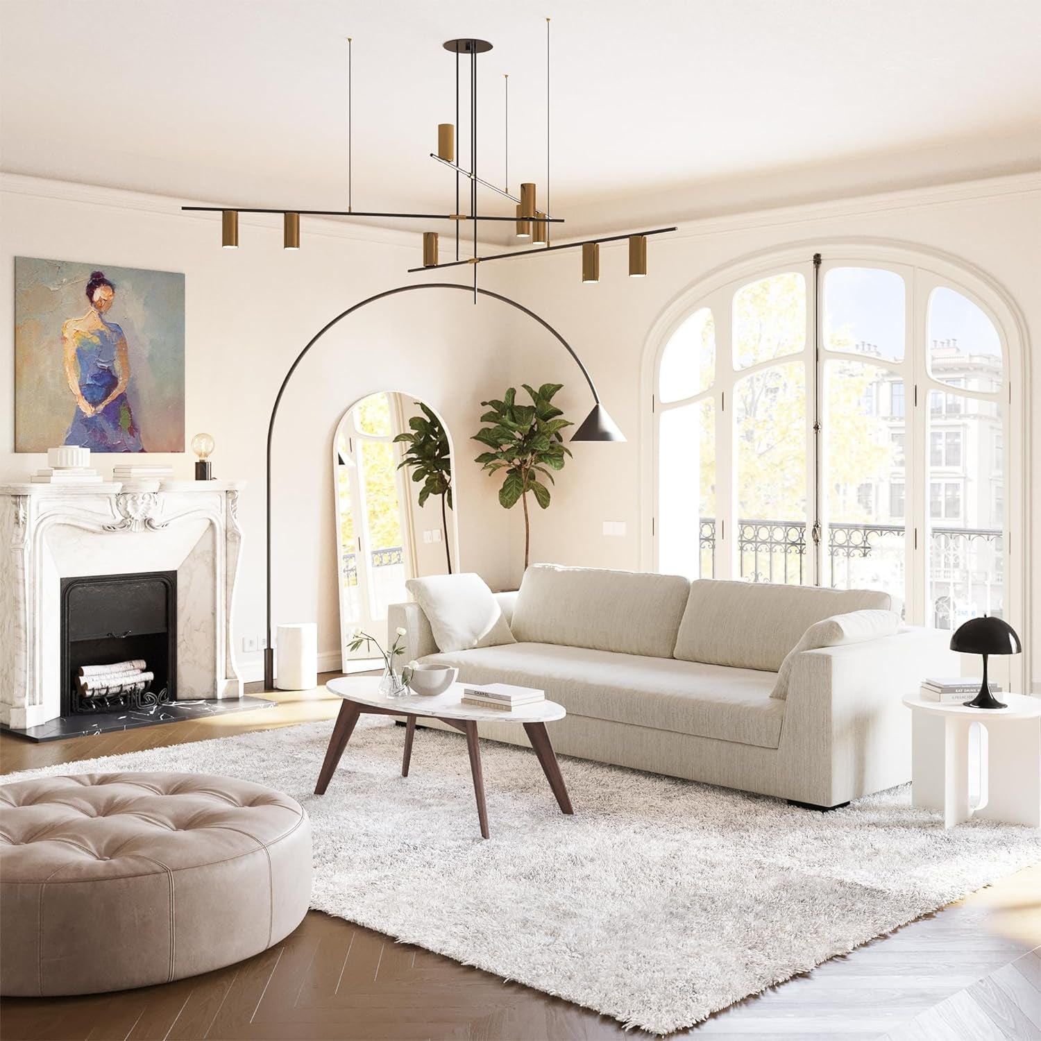 Modern living room with a white sofa, ottoman, and decorative elements.