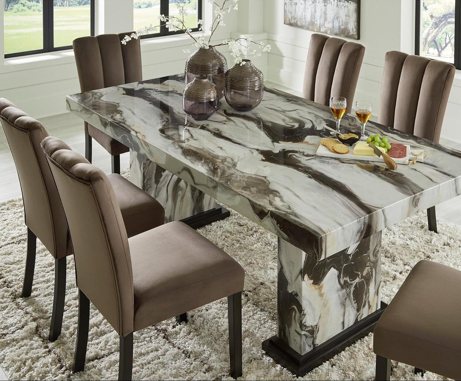 Dining room with a marble-style table and chairs, featuring the text 'Crafted for Your Home'.