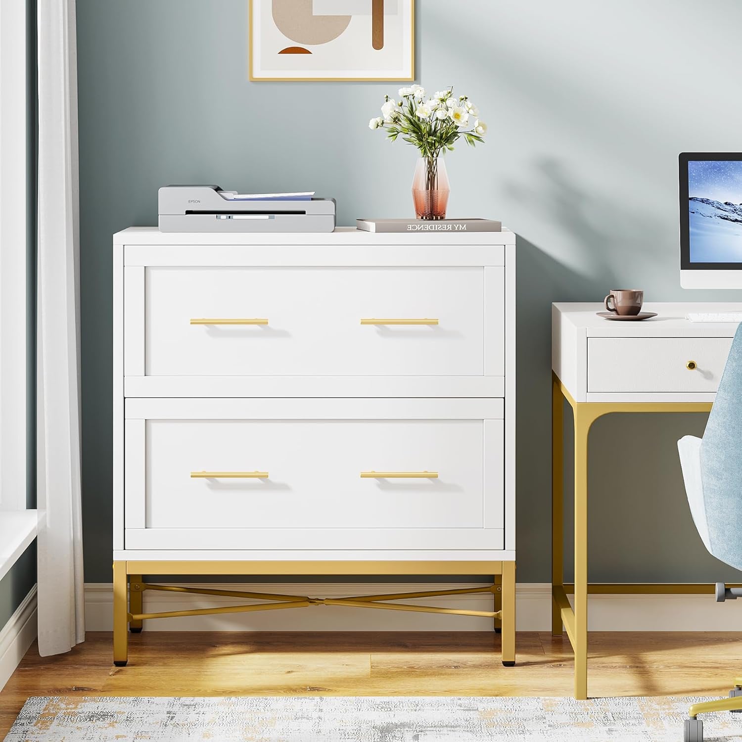 White dresser with gold legs and drawers in a room with a desk and decor items.