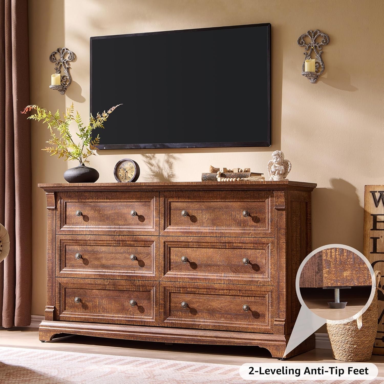 Wooden dresser with TV above in a room setting