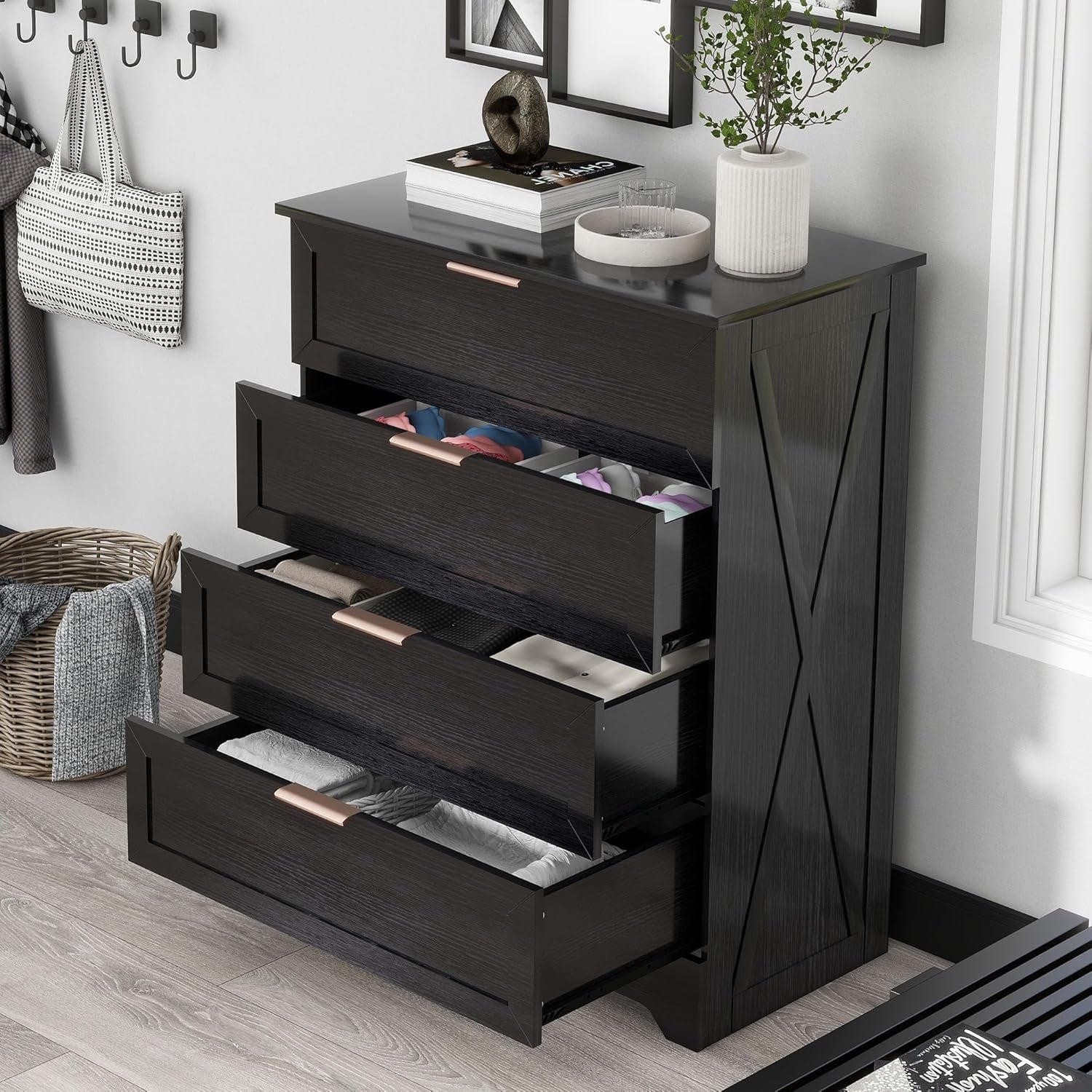 Black dresser with open drawers in a room setting