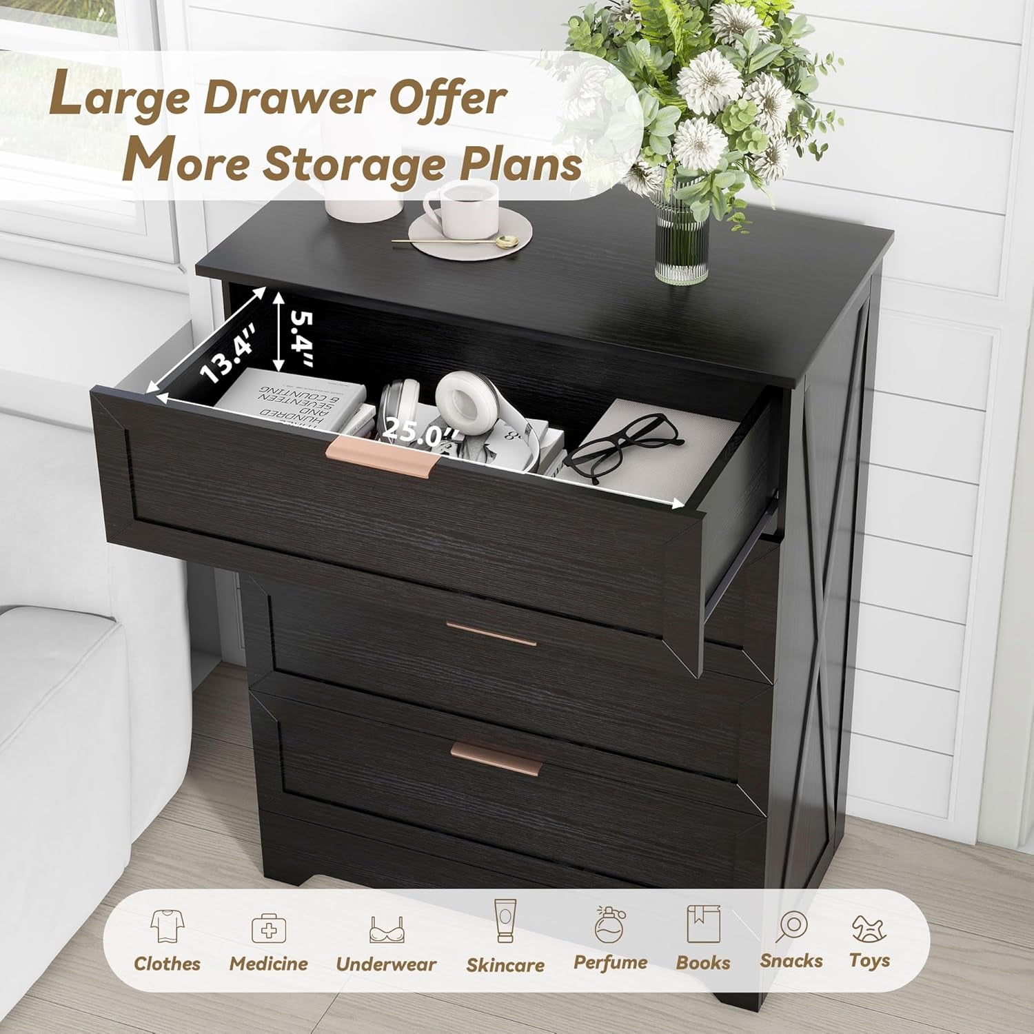 Black nightstand with open drawer displaying items, surrounded by a white couch and decorative flowers.