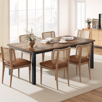 Dining room with a wooden table and chairs in a bright room.