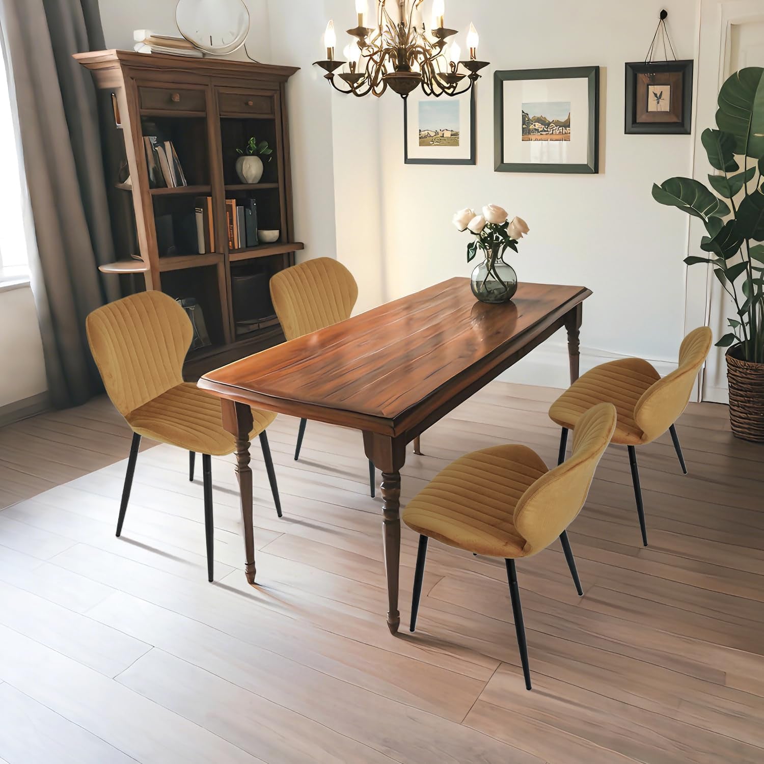 Dining room with wooden table and chairs, bookshelf, and decorative elements.