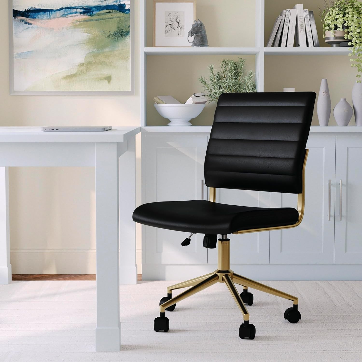 Black office chair with gold accents in a home office setting
