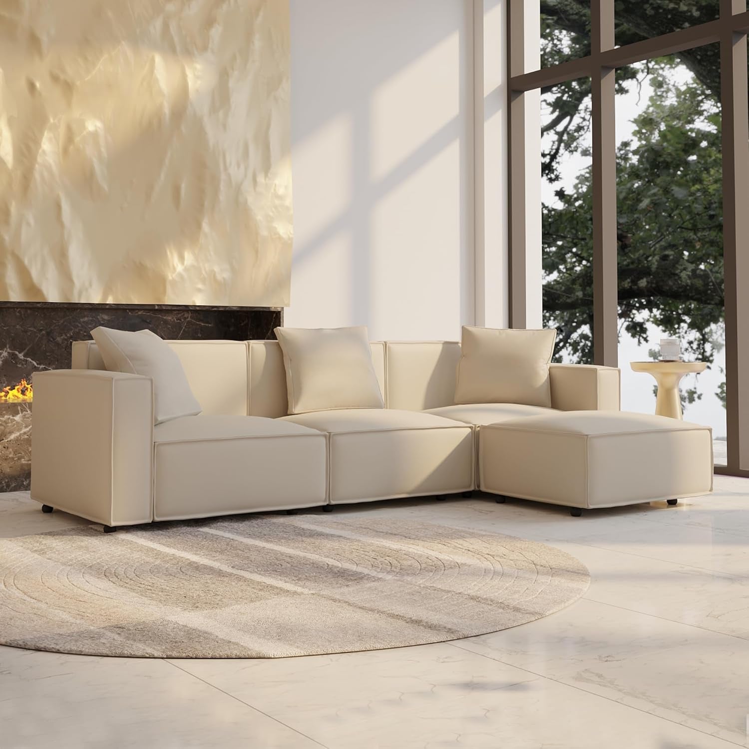 Beige sectional sofa in a modern living room with large windows.