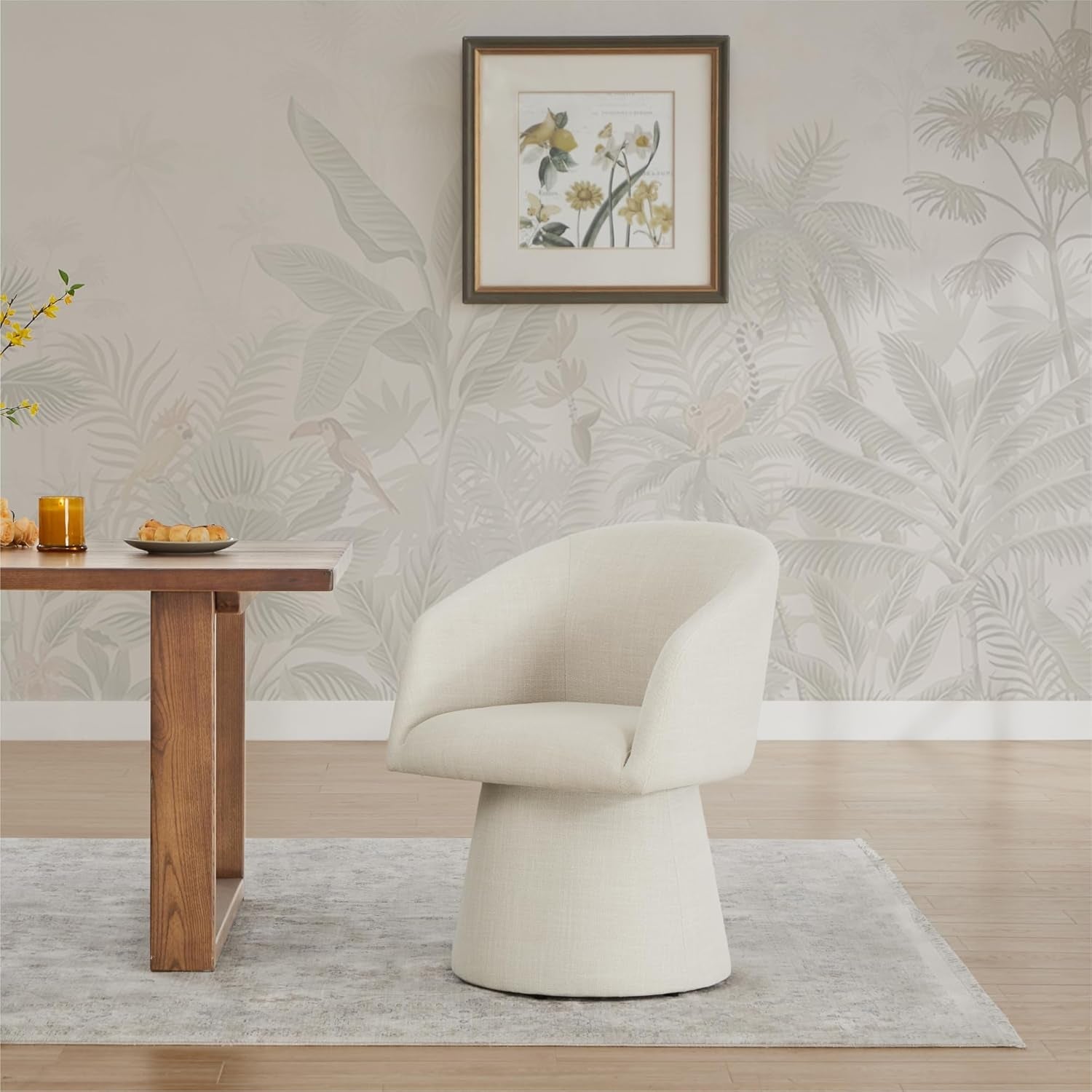 Modern dining room with a wooden table, beige chair, and decorative wall art.