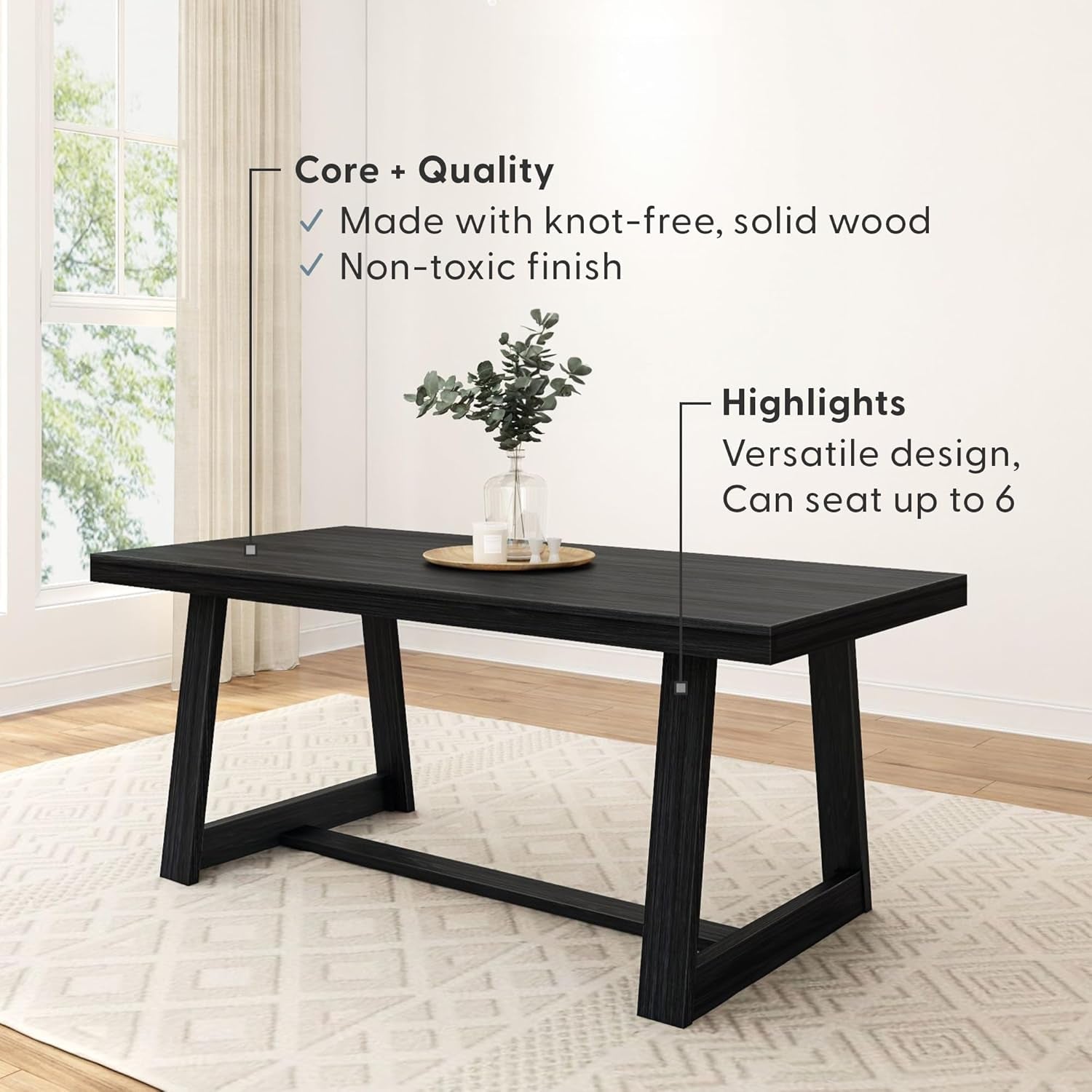 Black dining table in a room with text highlighting its features