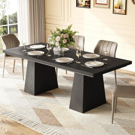 Dining table set with plates, glasses, and a floral centerpiece in a well-lit room.
