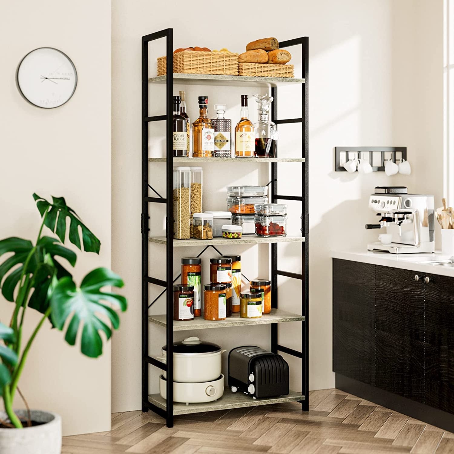 Tall black metal shelving unit in a kitchen with various items on shelves.