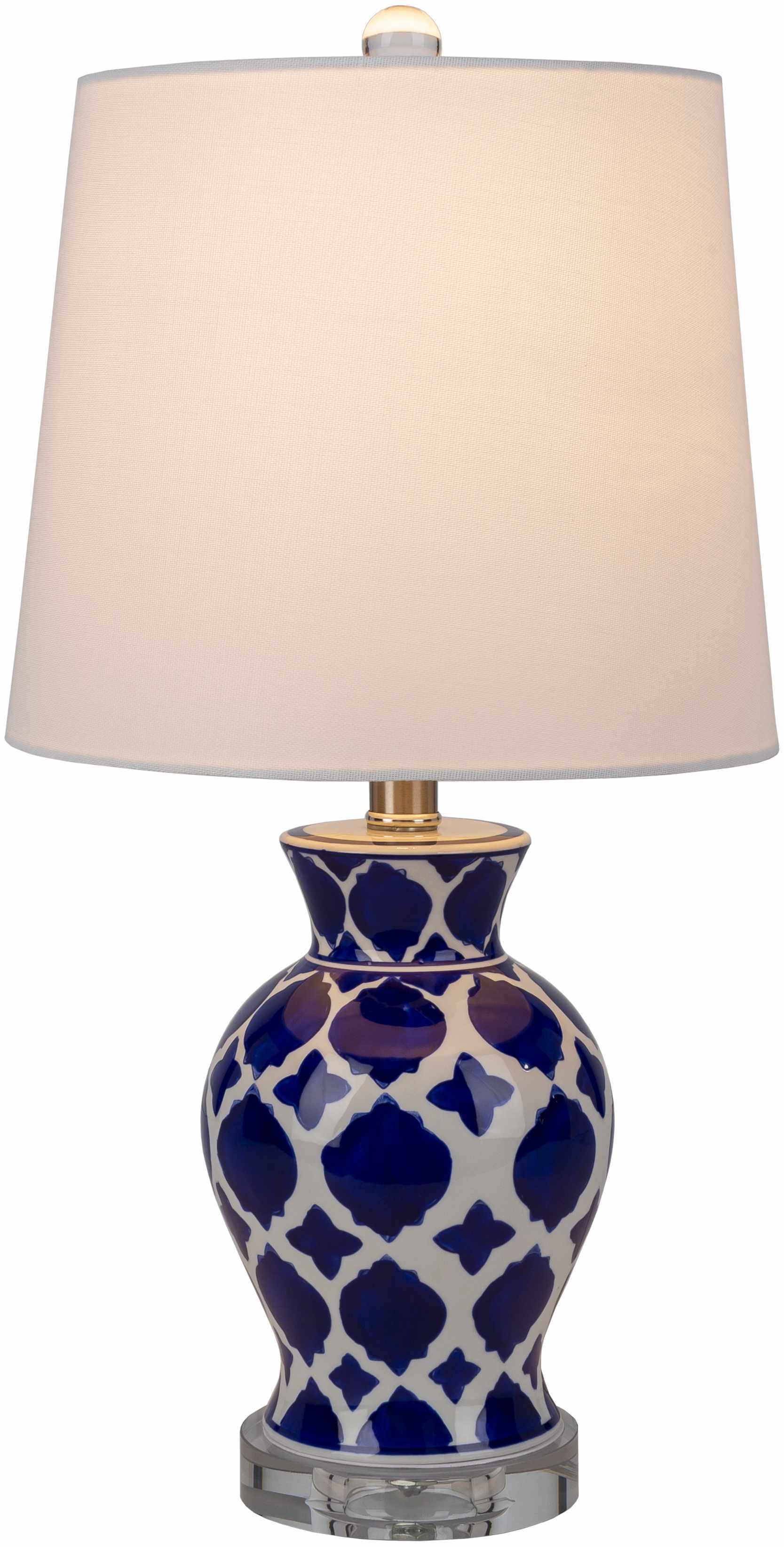 Table lamp with blue and white patterned base and beige lampshade on a white background