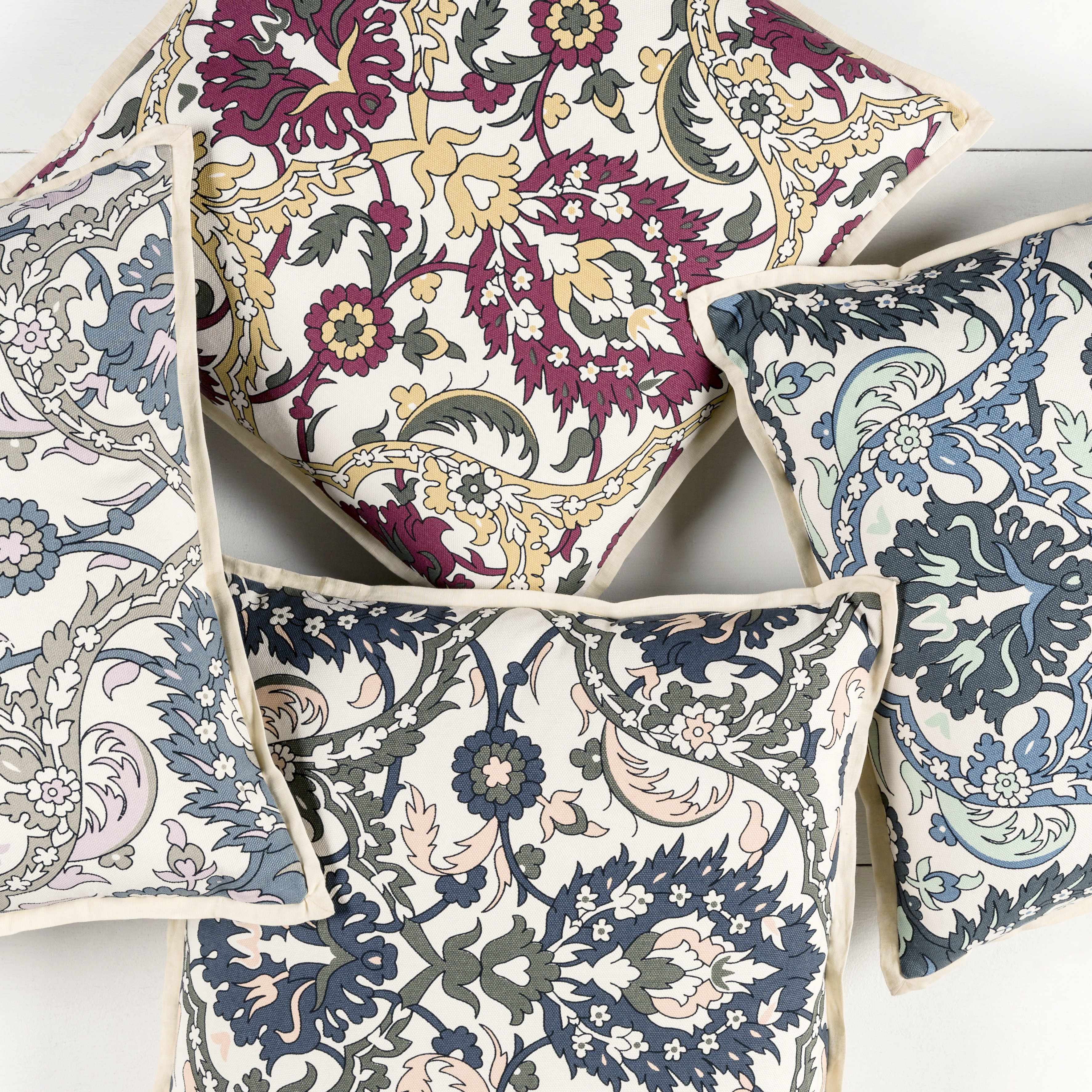 Set of patterned cushions on a white background