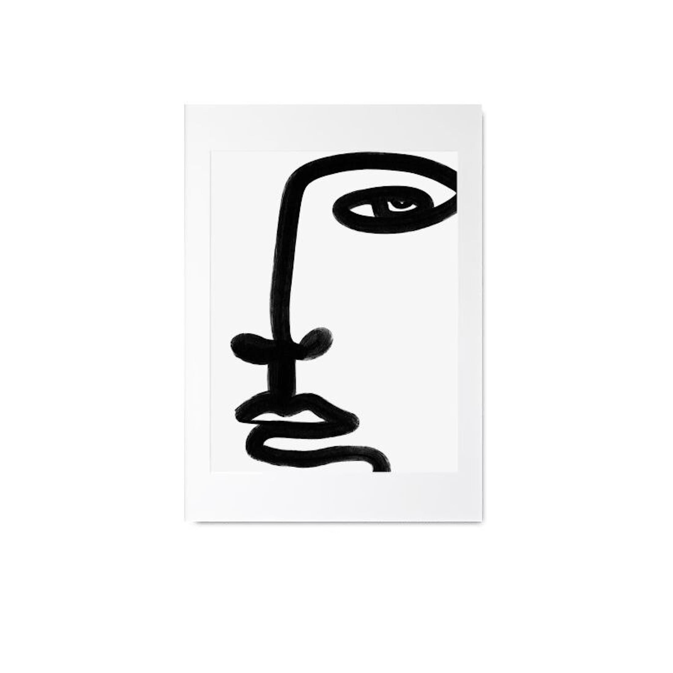 Black abstract face design on a white background