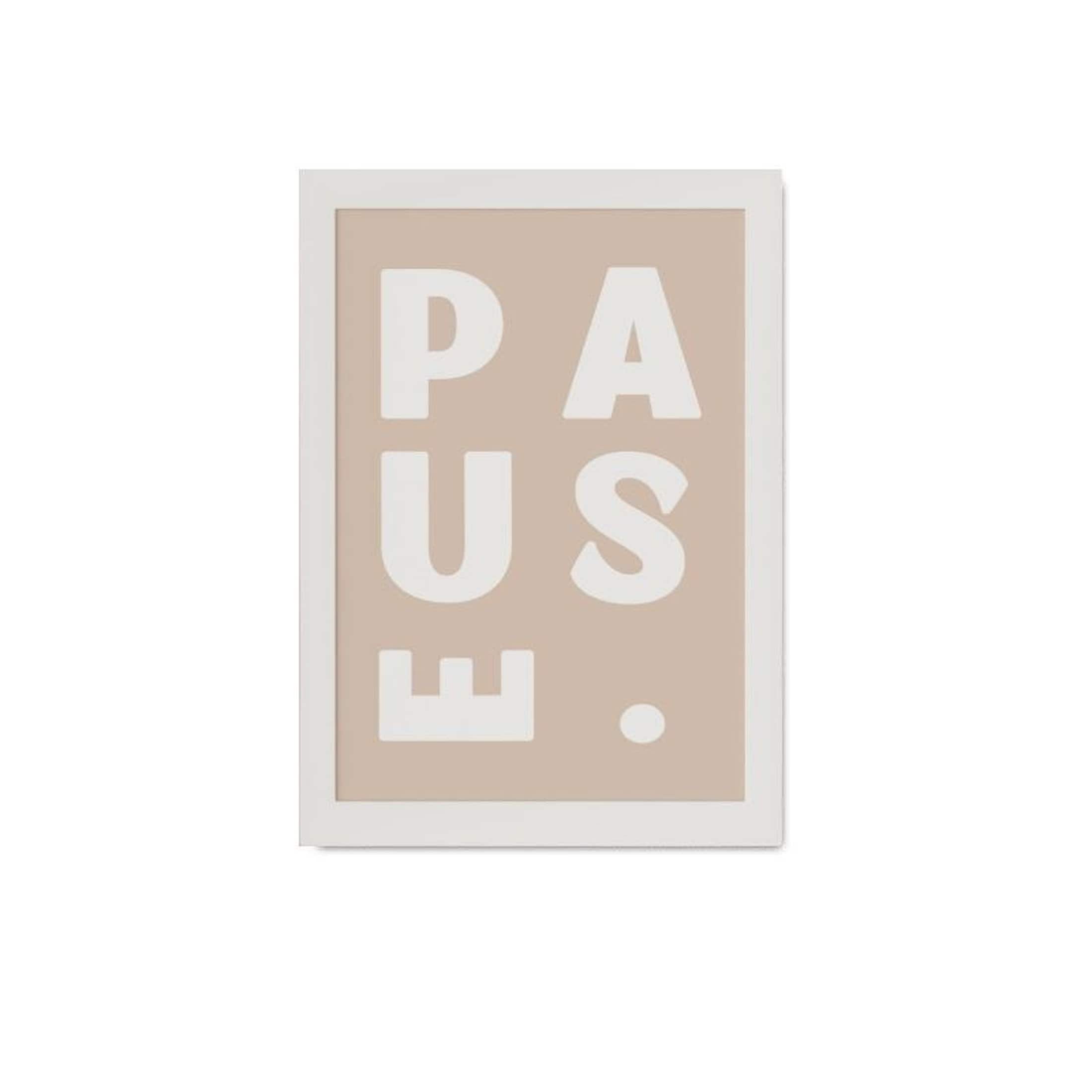 Framed artwork with 'PAUSE' text on a beige background