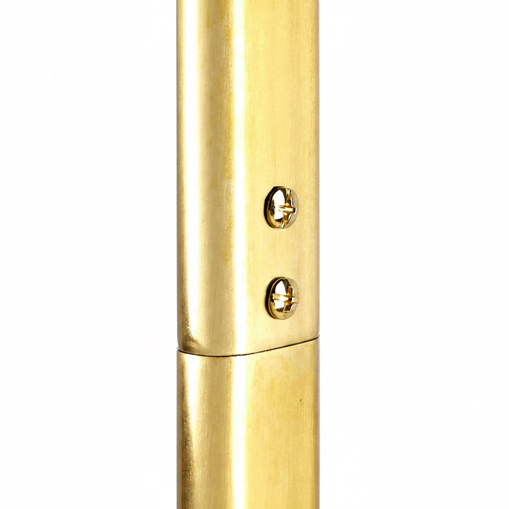 Gold cylindrical object with a small round component on a white background