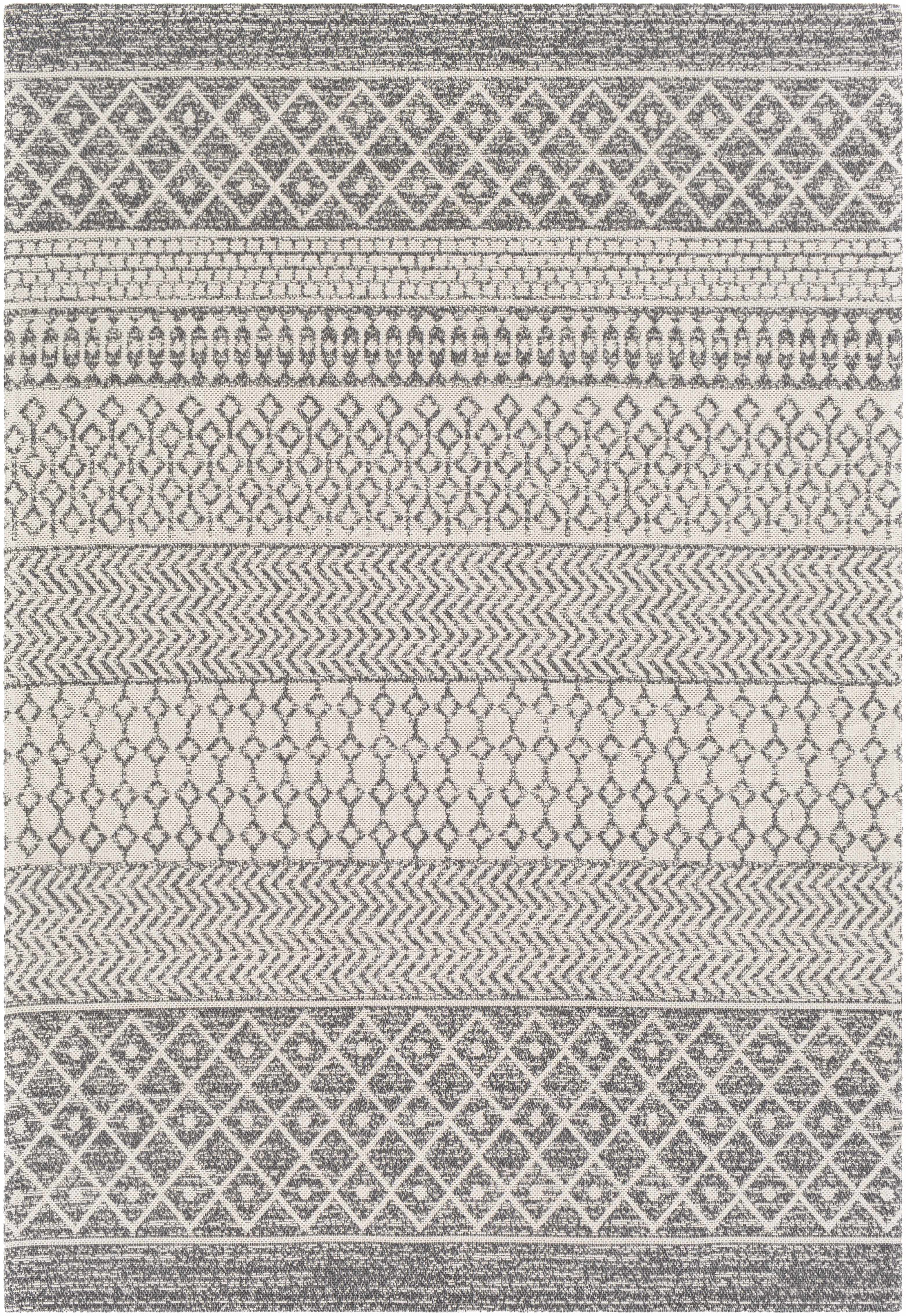 Patterned rug with geometric design in gray and white