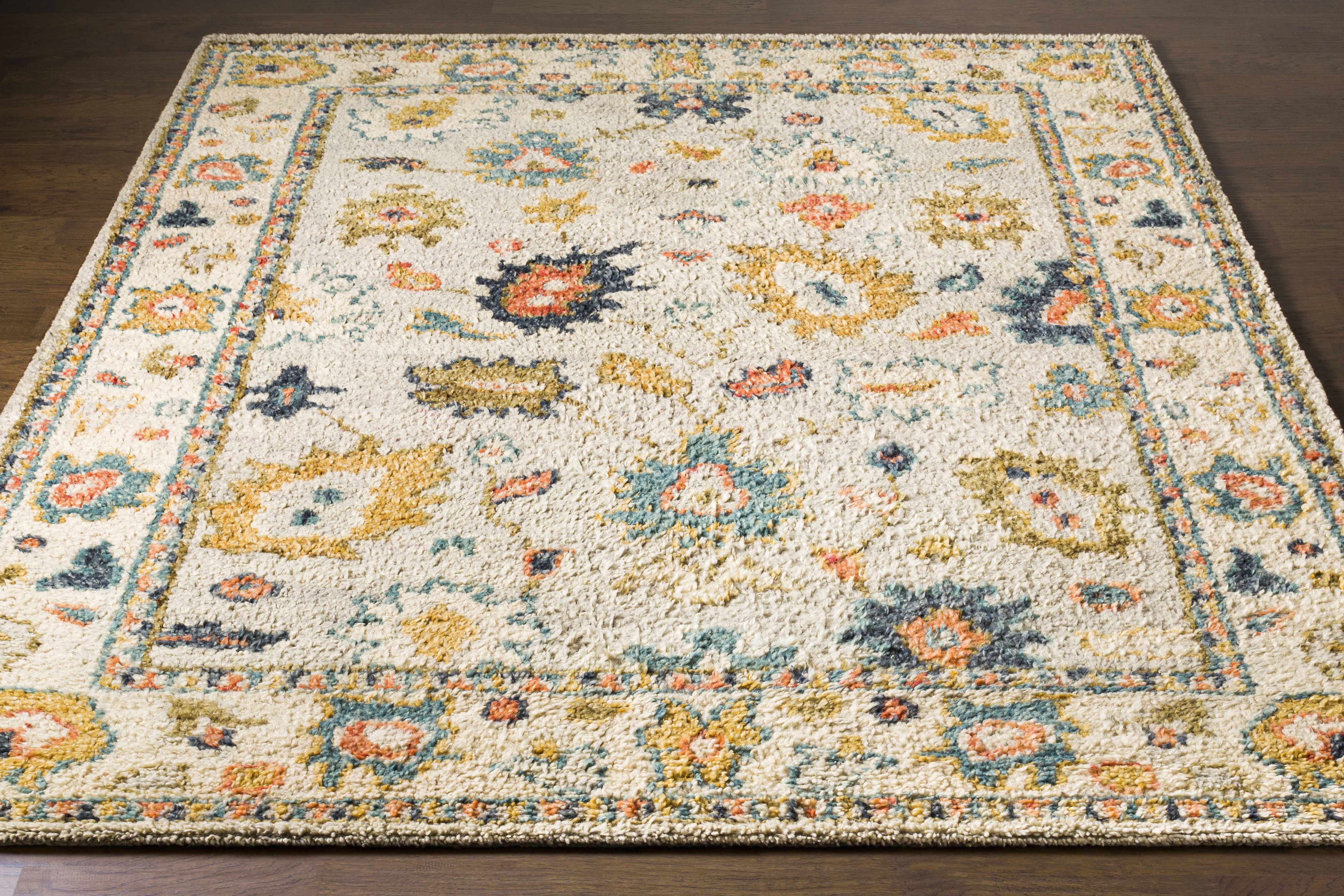Decorative rug with floral patterns on a wooden floor