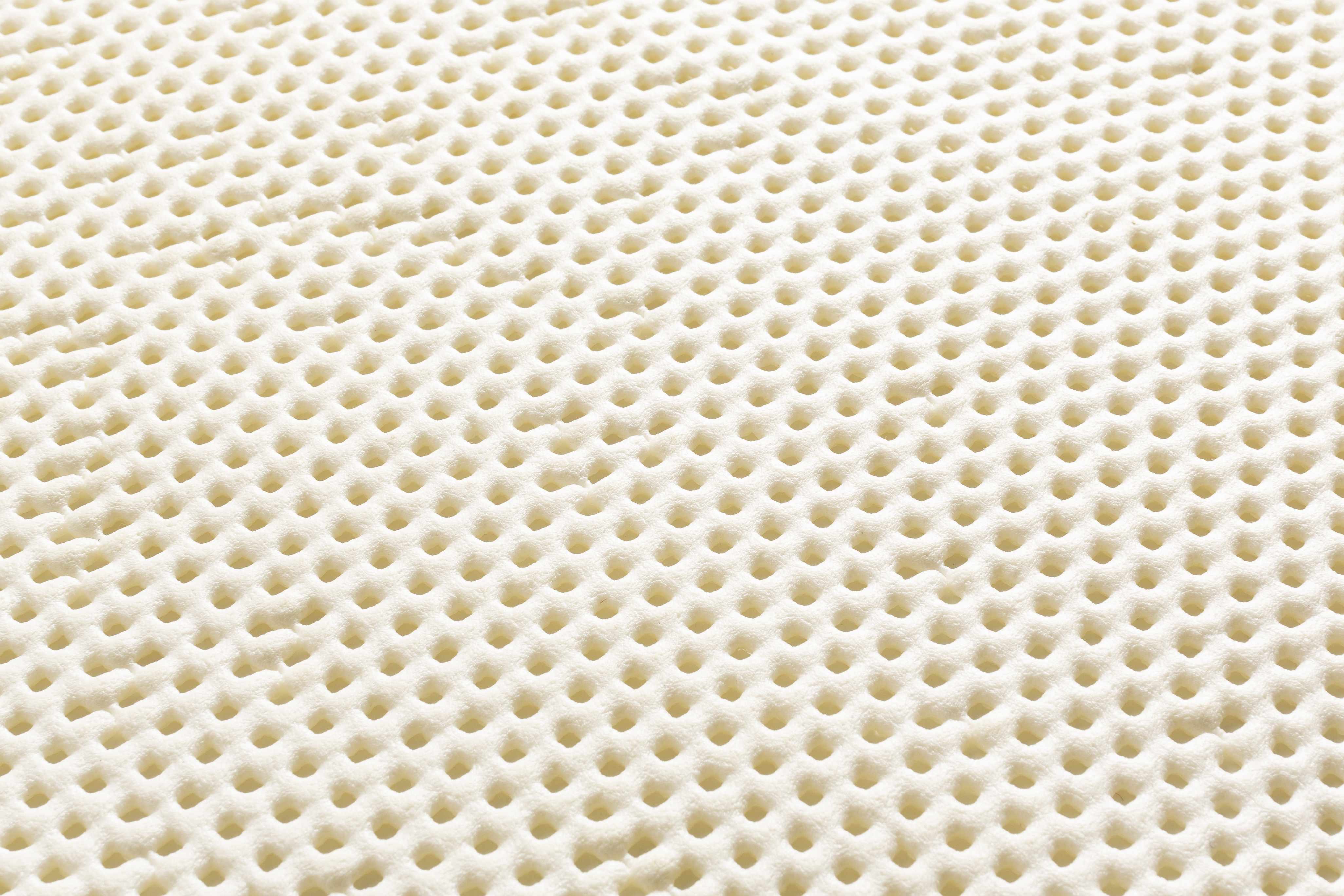 Close-up of a textured beige surface with circular patterns
