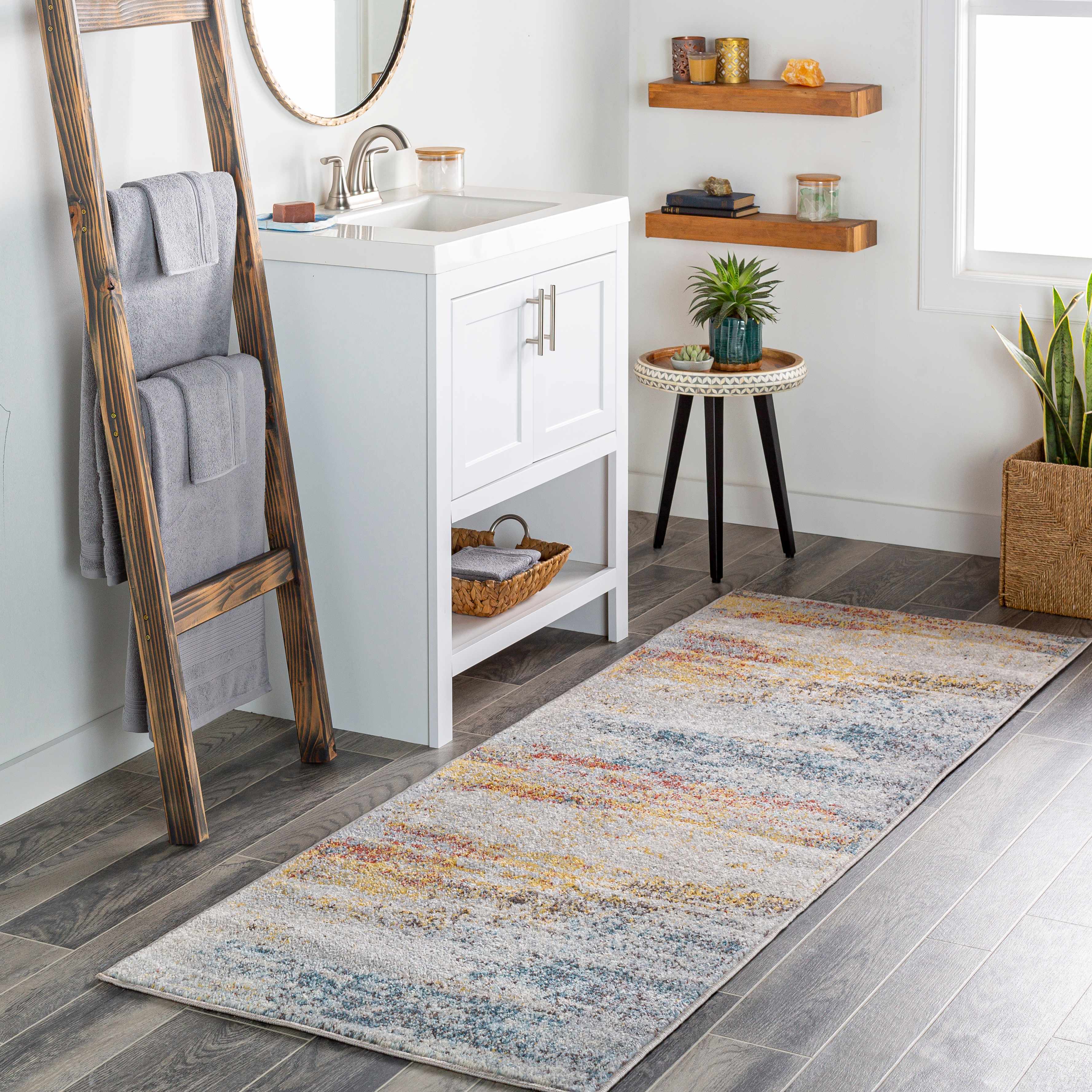 Bathroom with a wooden ladder, sink, and decorative rug.