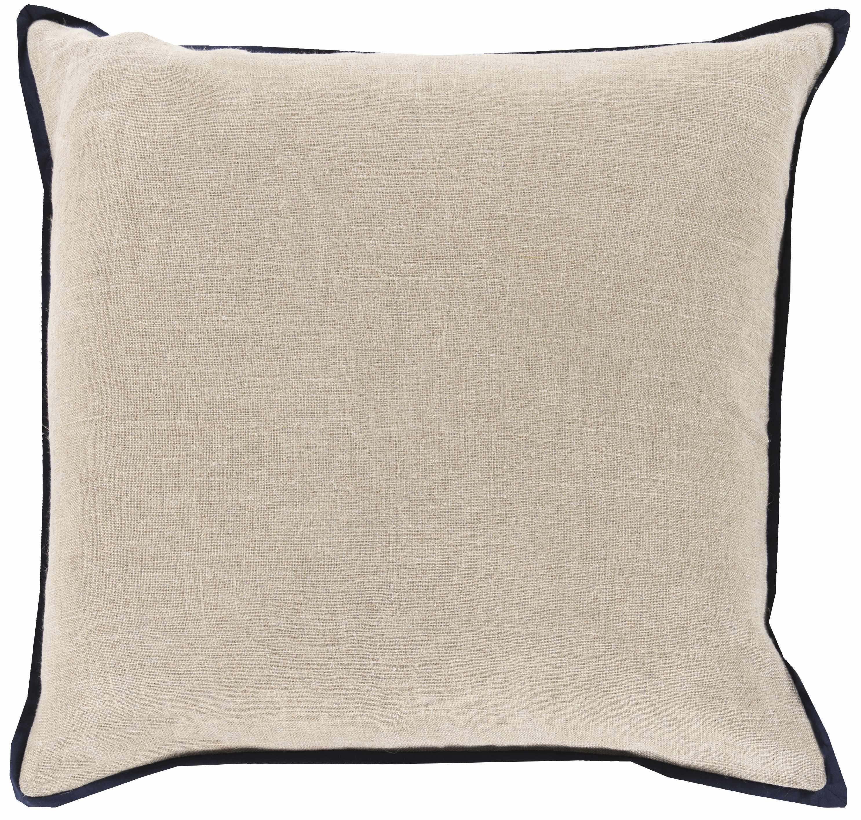 Beige pillow with black trim on a white background