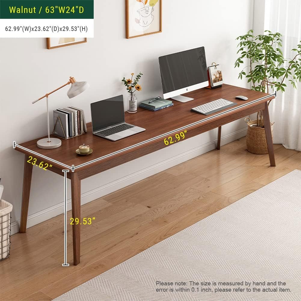 Wooden desk with laptop, monitor, and other items in a room with plants and measurements.