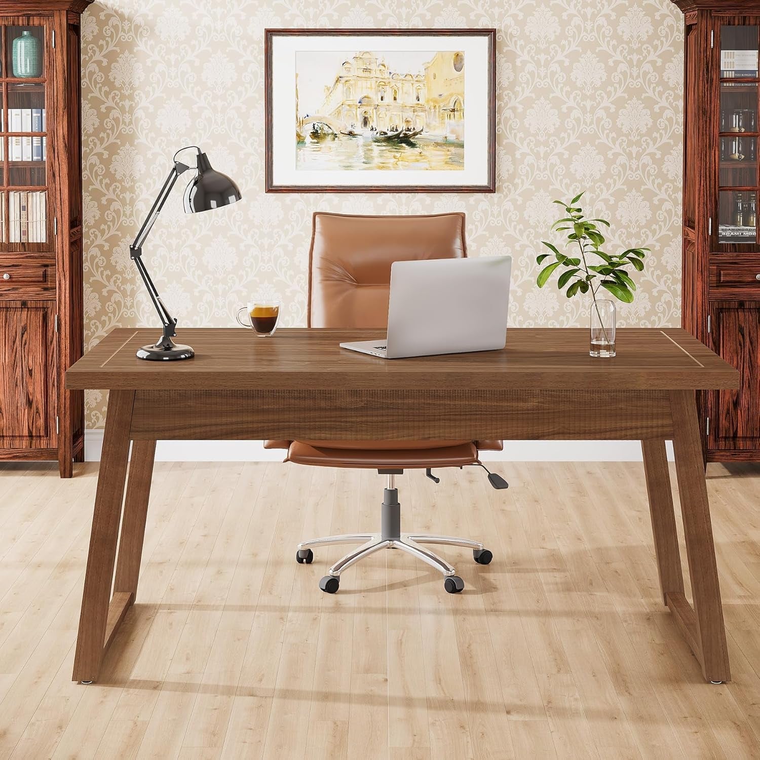 Wooden desk with a laptop, lamp, and chair in an office setting.