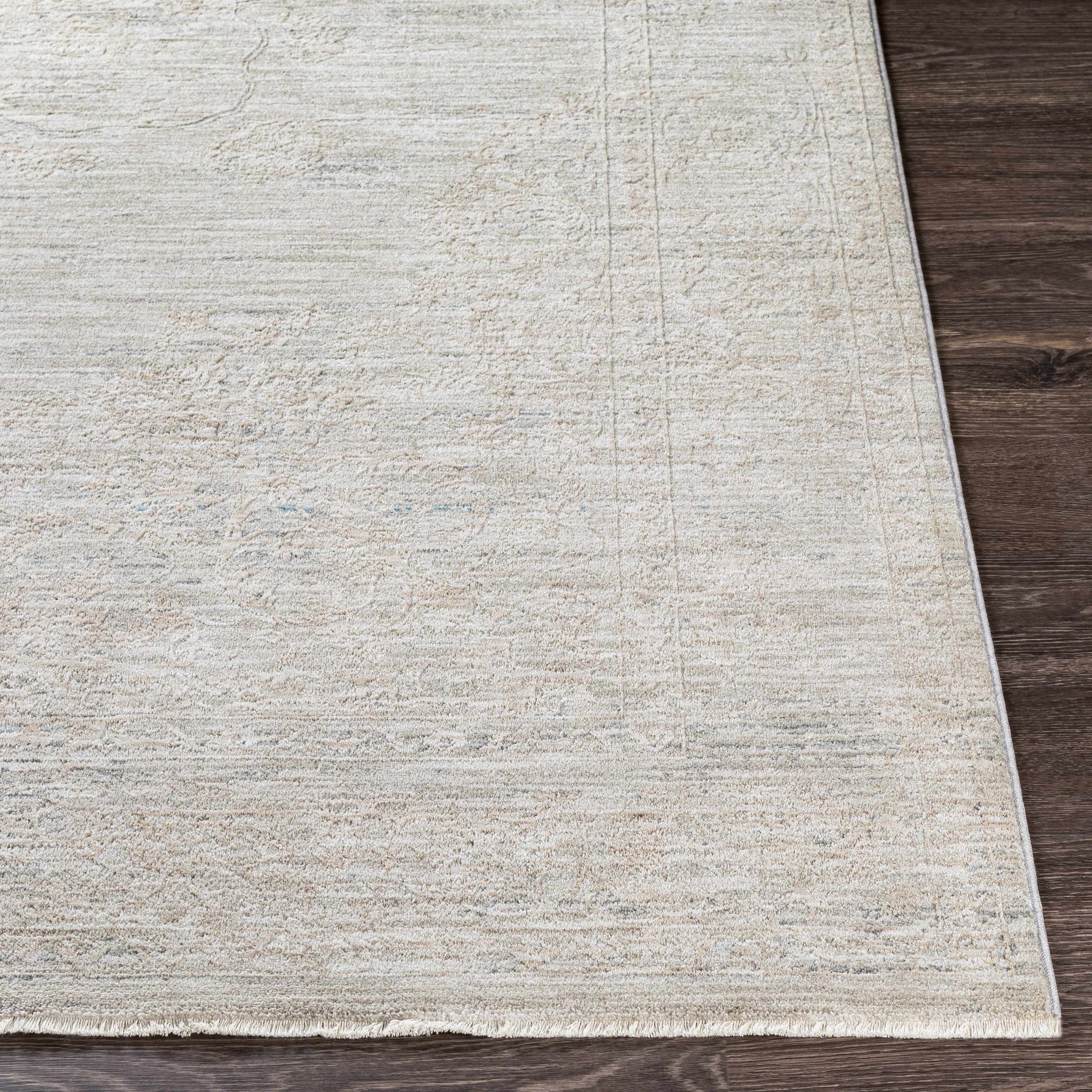 Textured area rug on a wooden floor