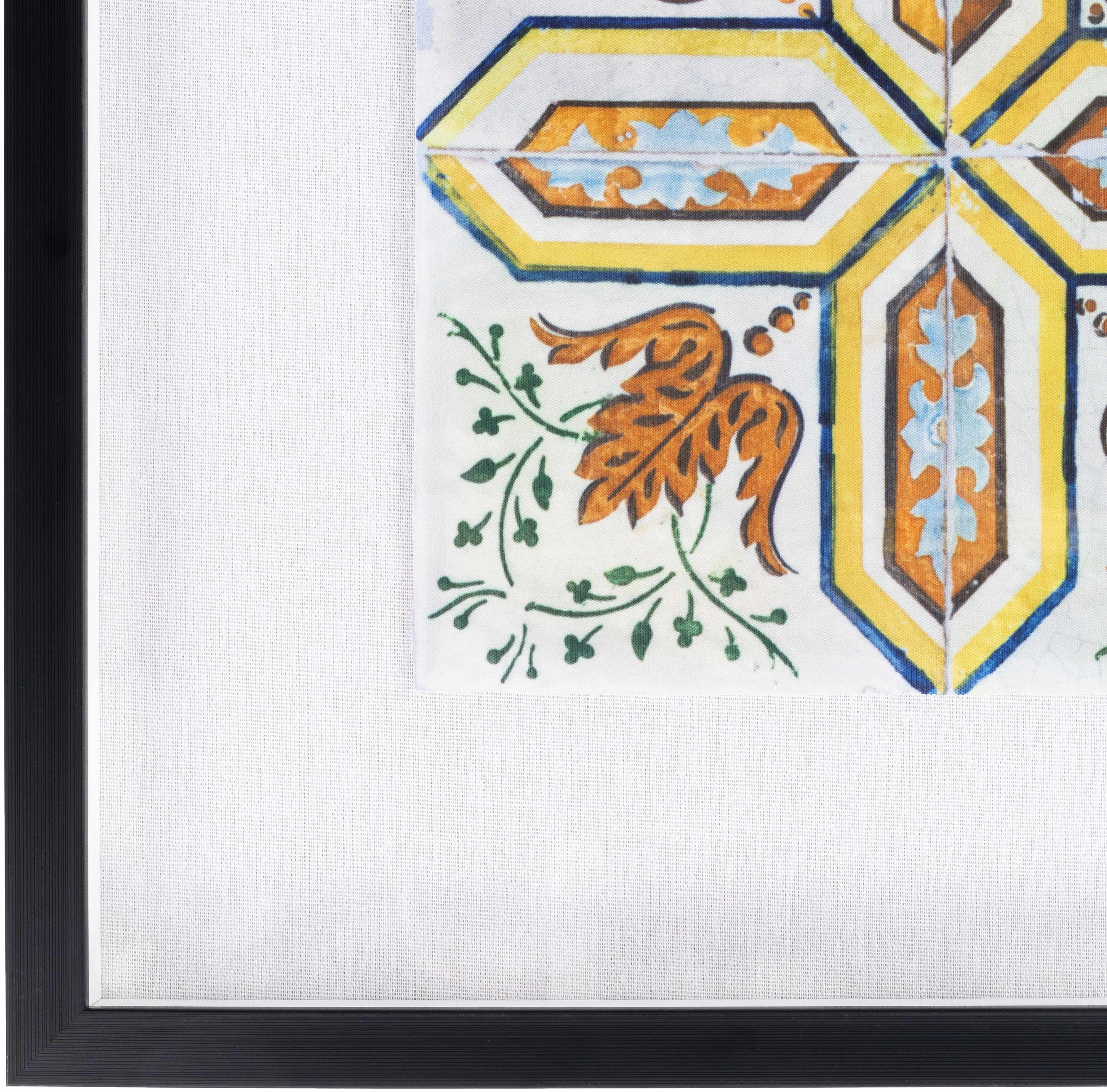 Decorative tile with floral design and geometric patterns in a black frame.