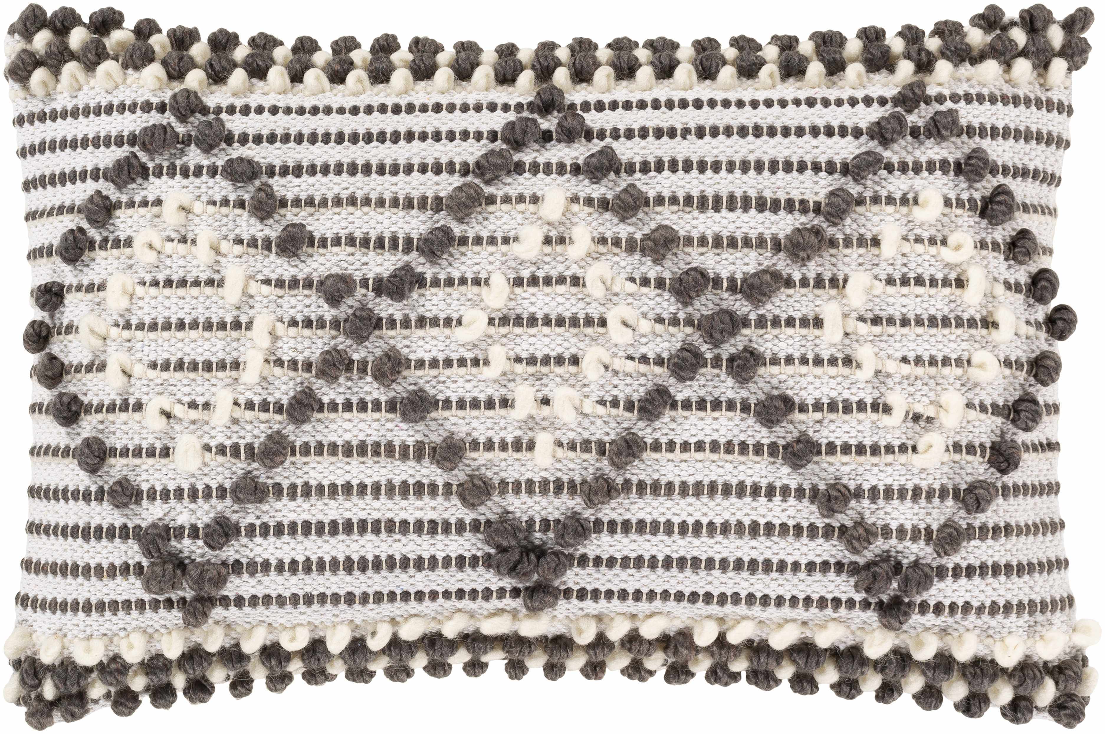Decorative pillow with black pom-pom details on a white background