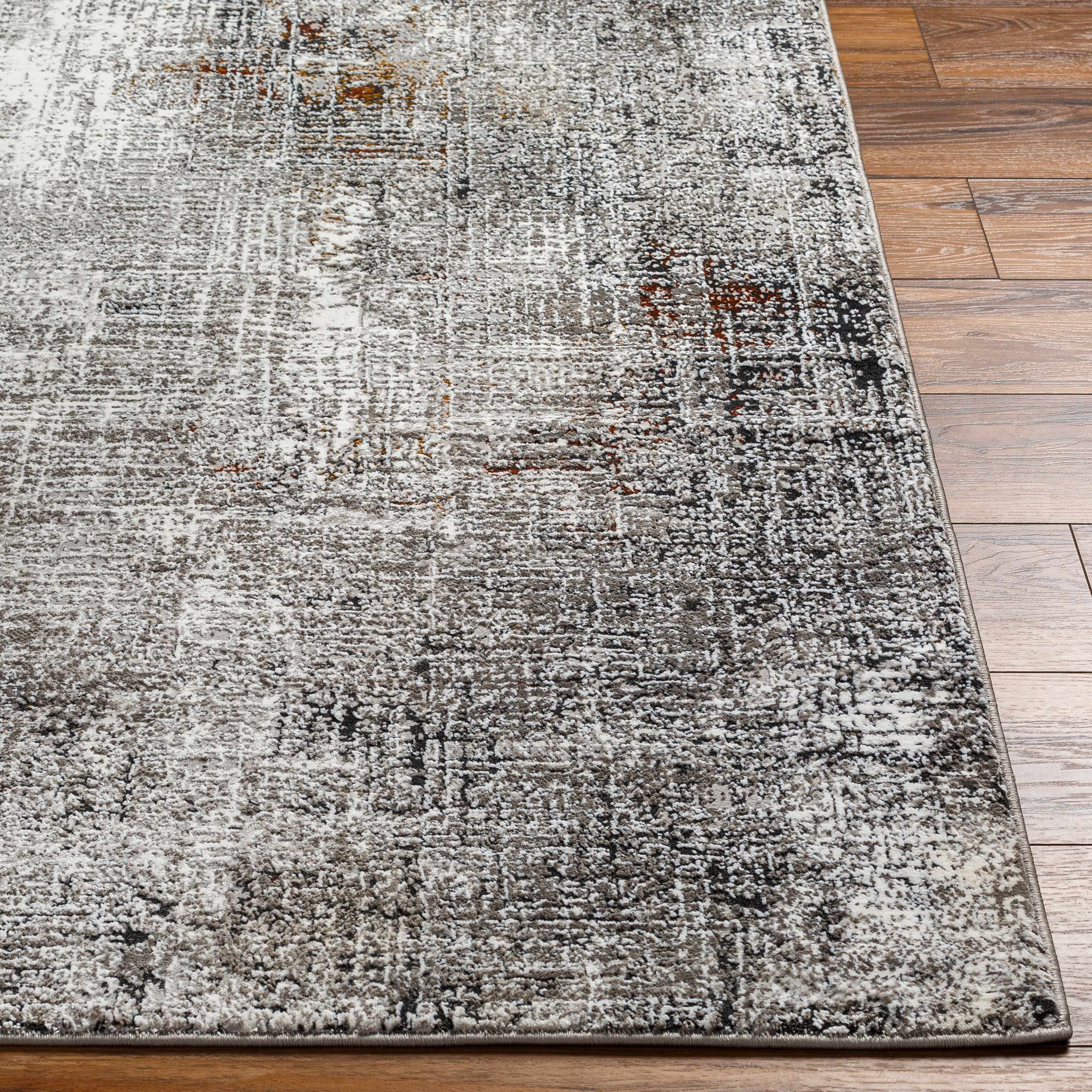 Textured area rug on a wooden floor