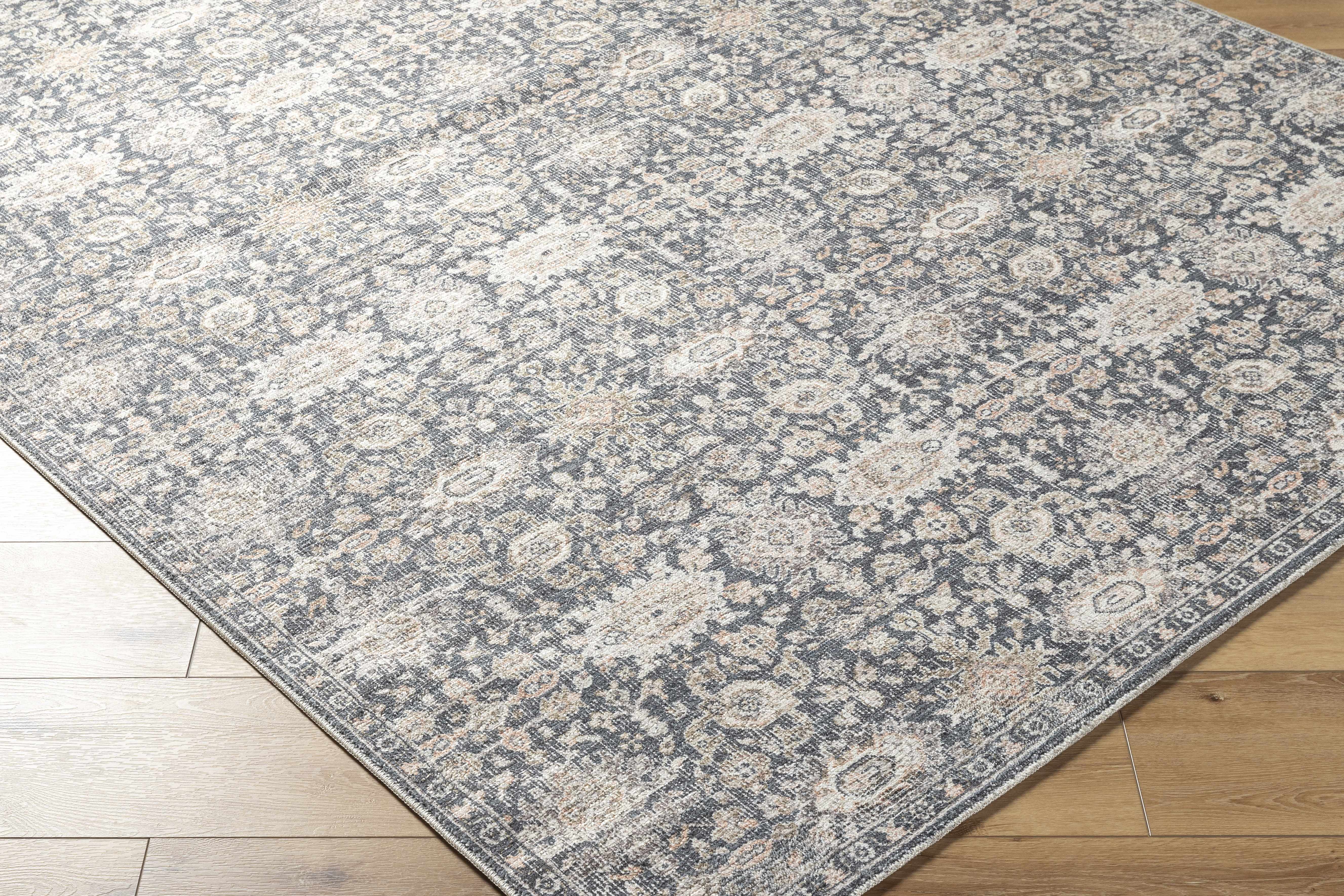 Patterned rug on a wooden floor