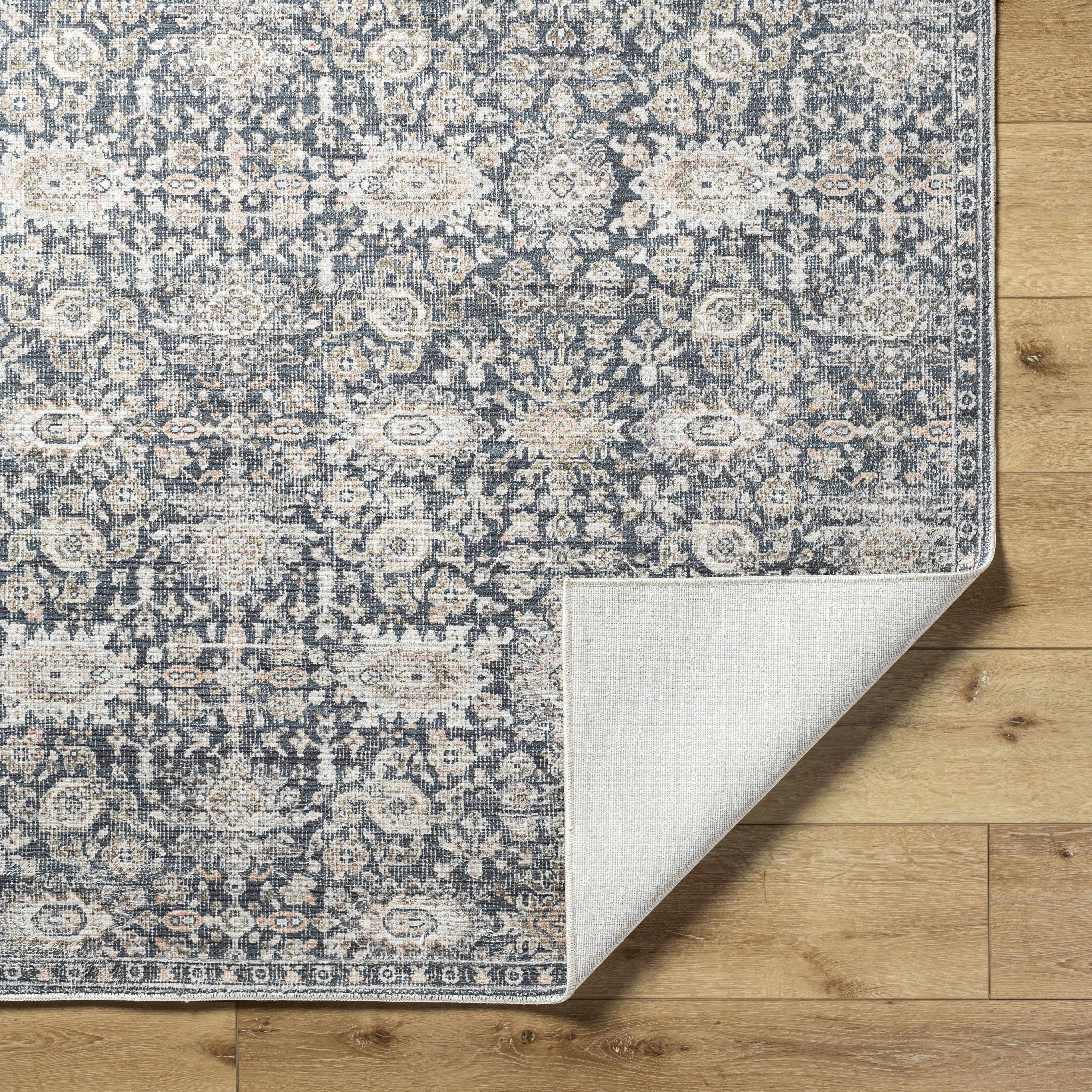 Patterned rug on a wooden floor