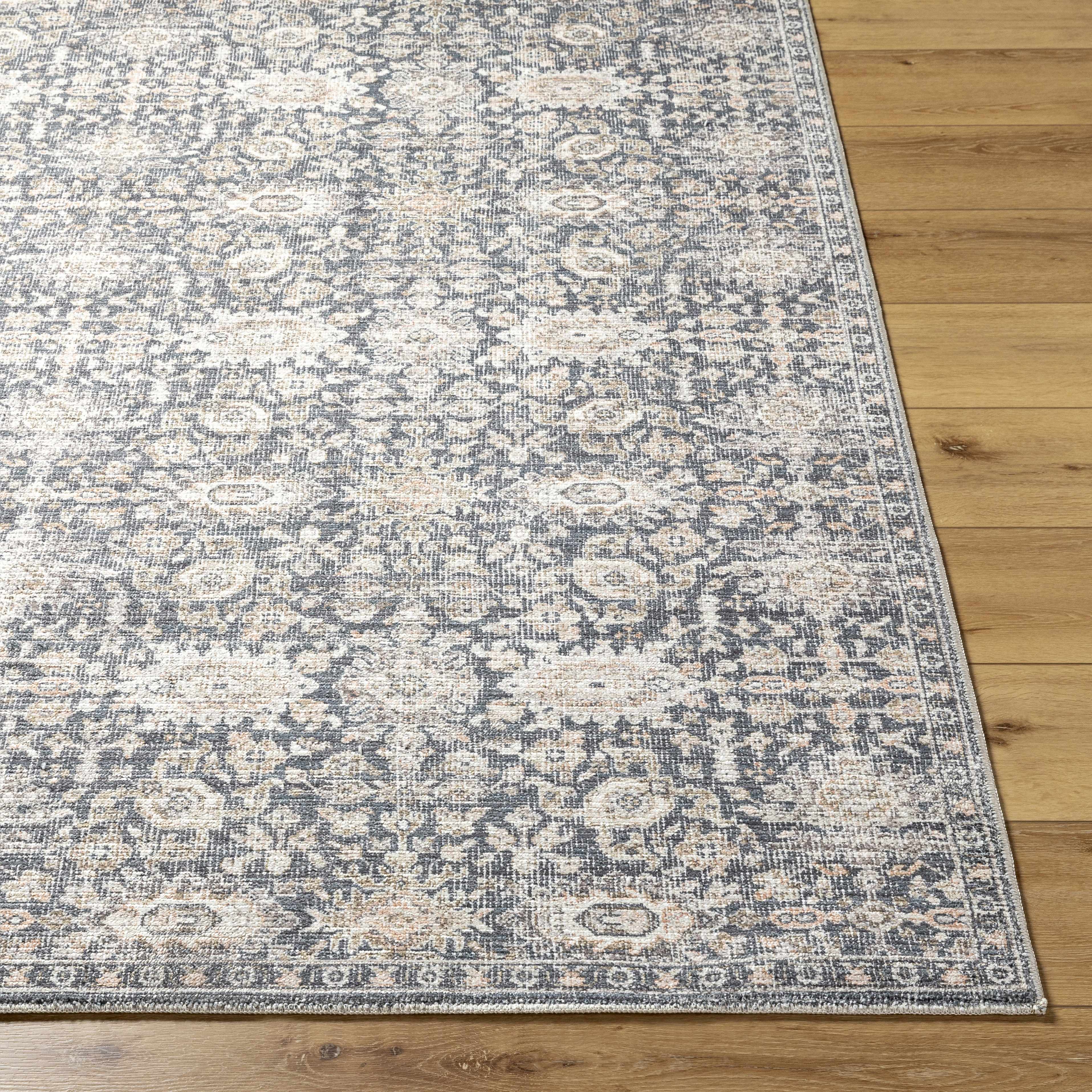 Patterned rug on a wooden floor