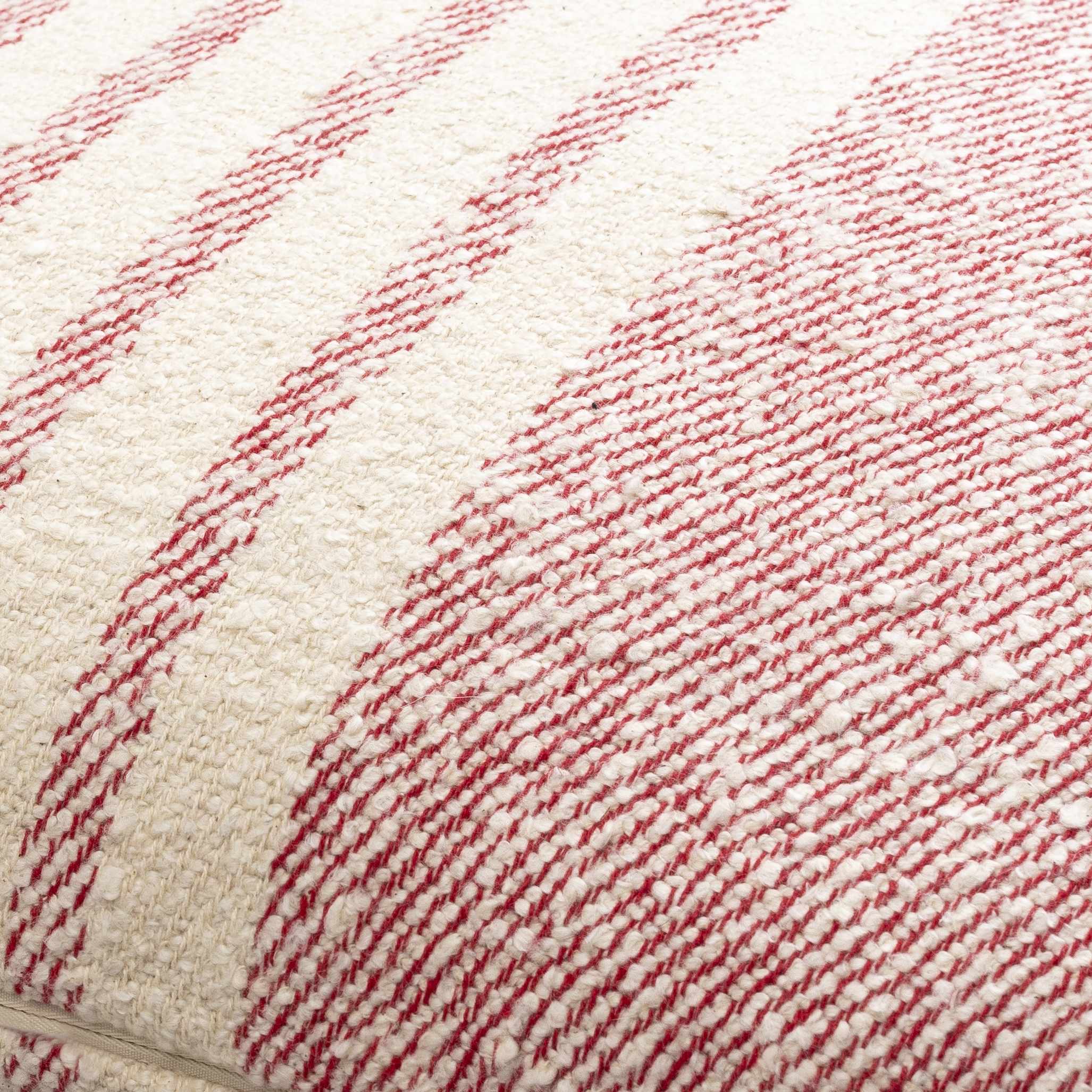 Close-up of a textured fabric with red and white pattern