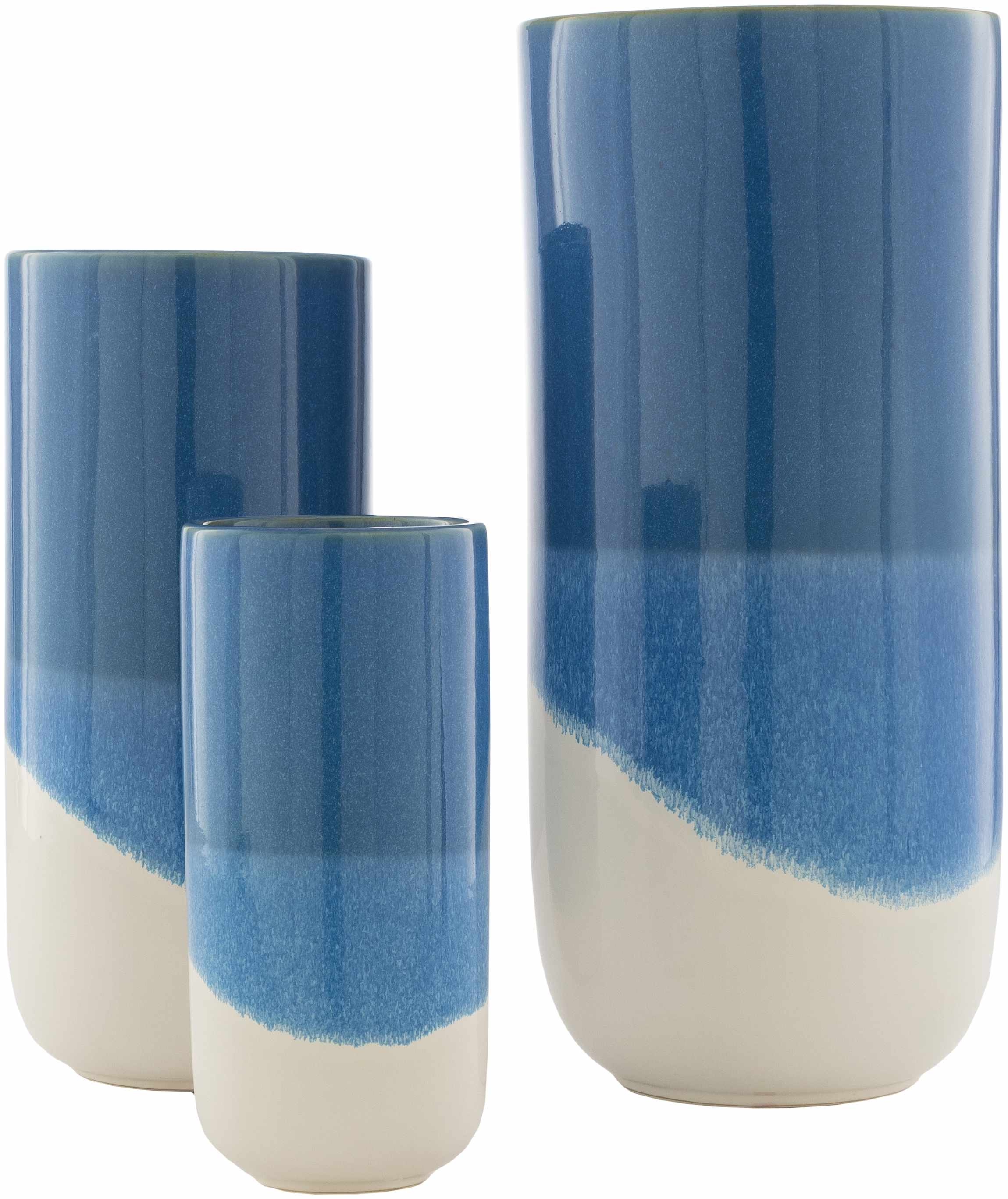 Set of three blue and white ceramic vases on a white background