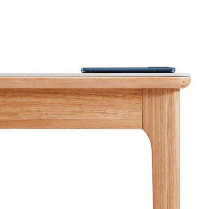 Wooden table with a smartphone on top against a white background