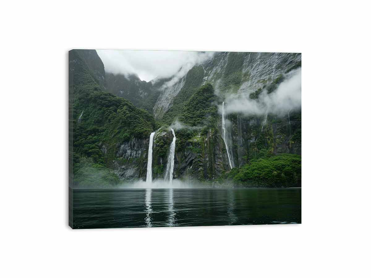 Canvas print of a waterfall in a lush green forest with misty mountains.