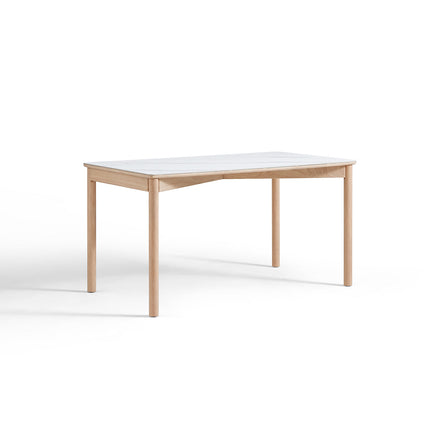 Wooden table with a white marble-like surface on a white background